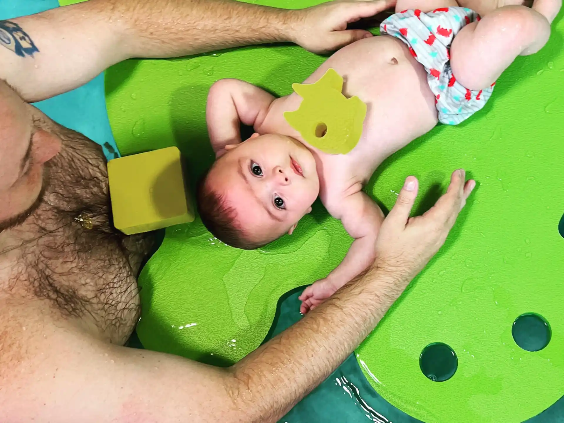 a baby in a pool