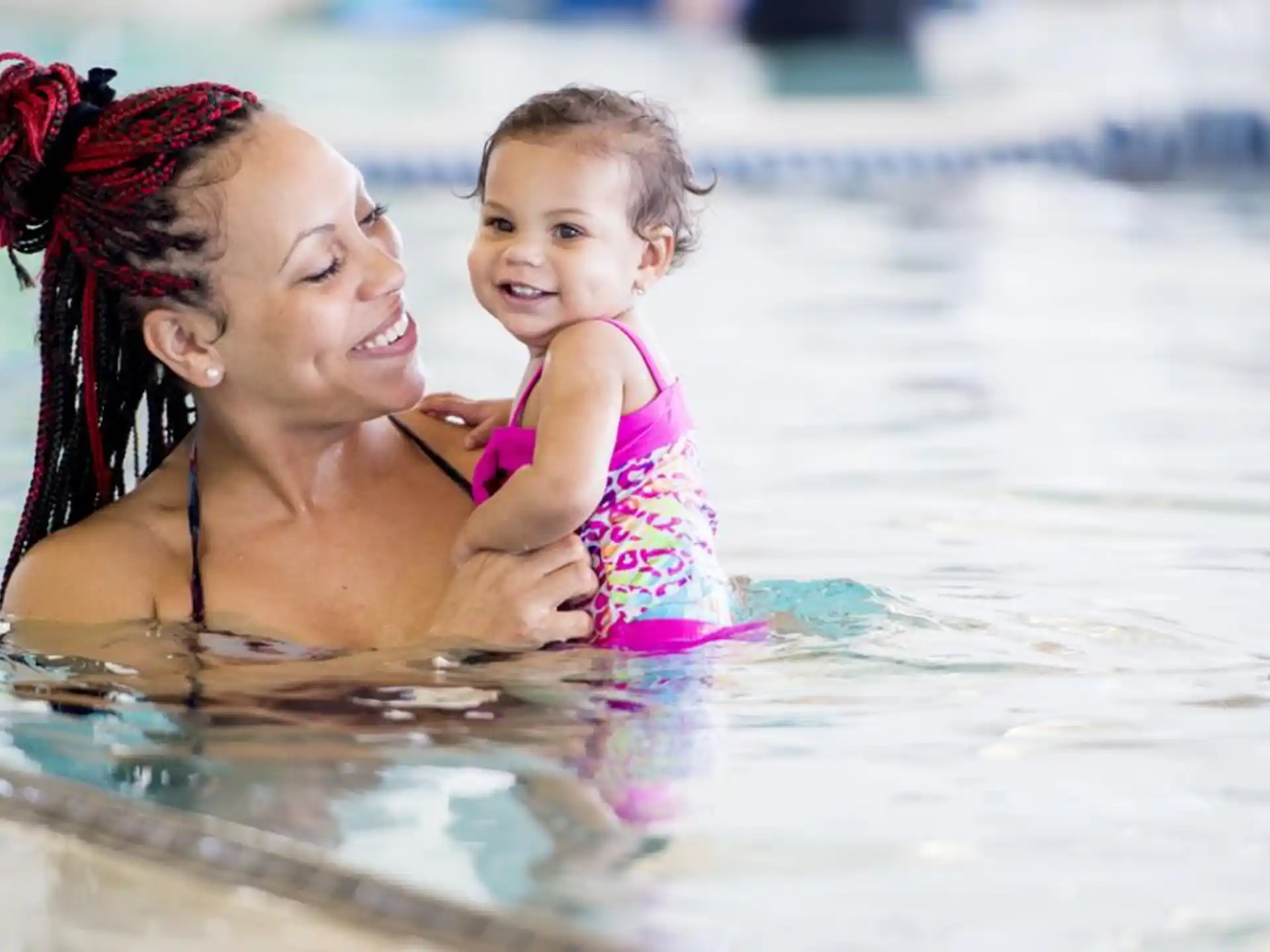 a person and a baby in the water