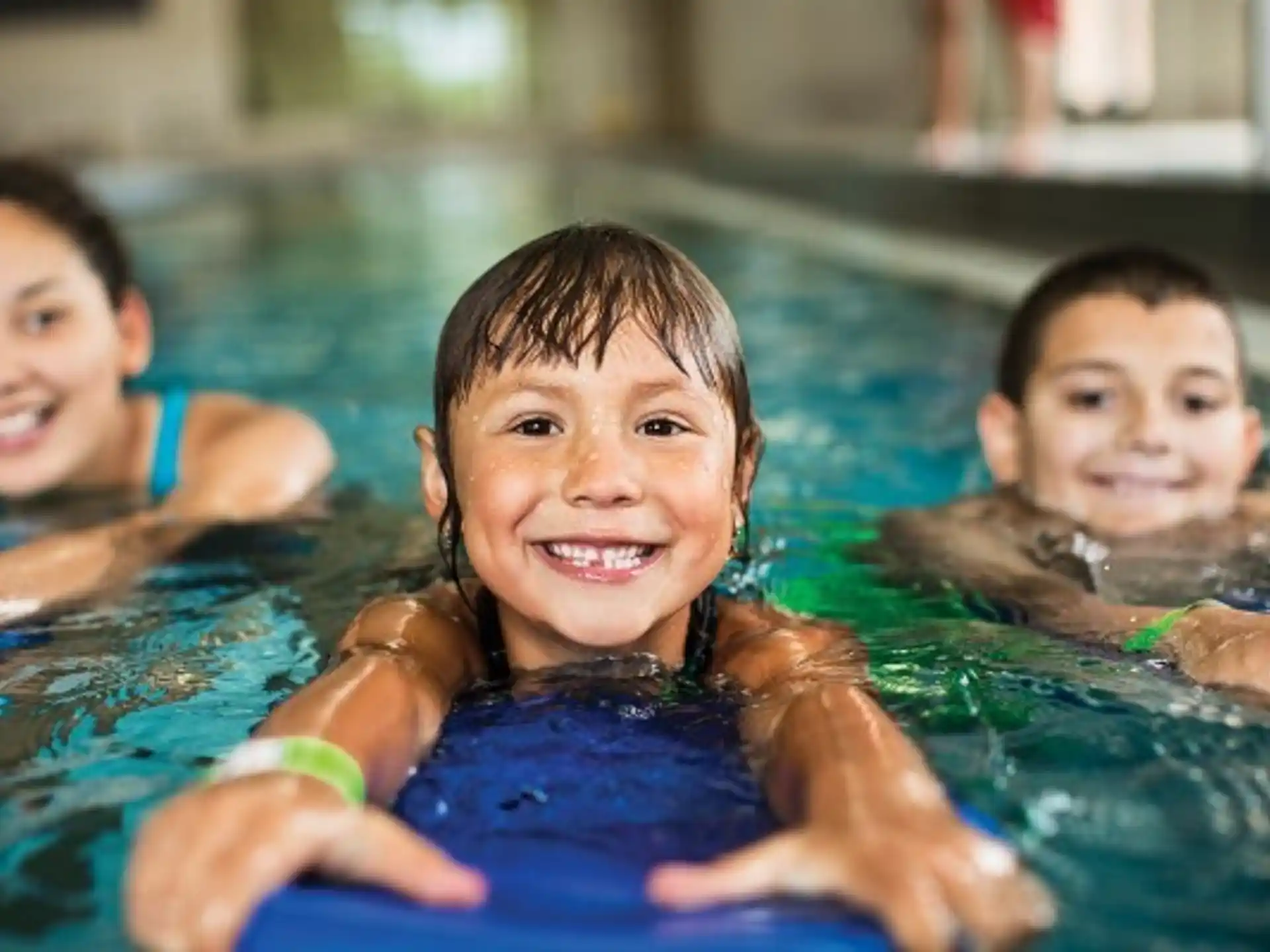 a group of children in a pool