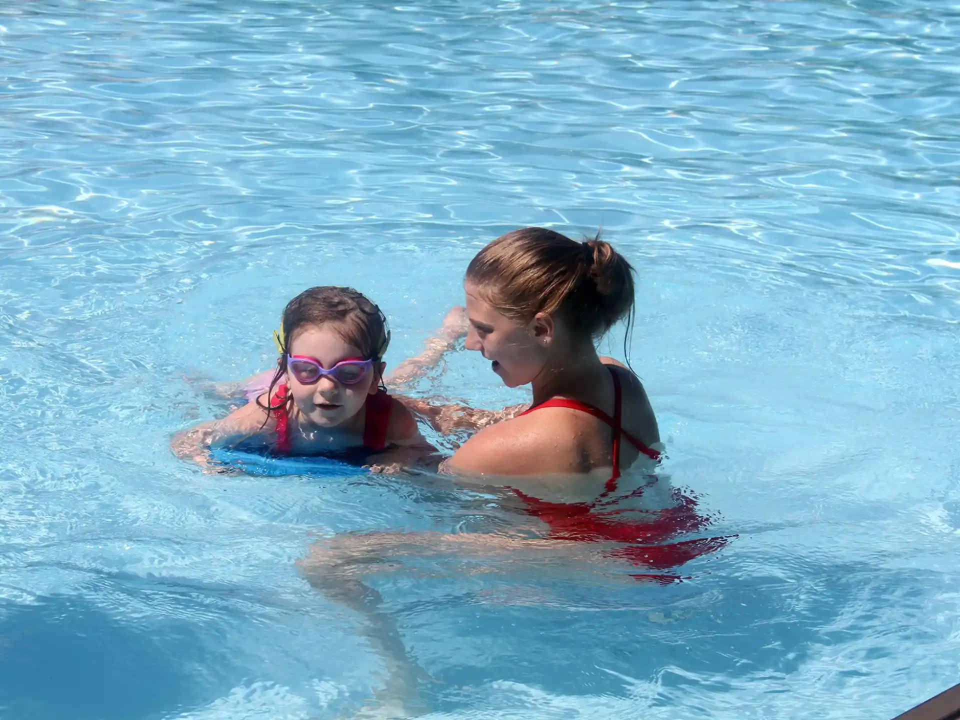 a group of girls in a pool