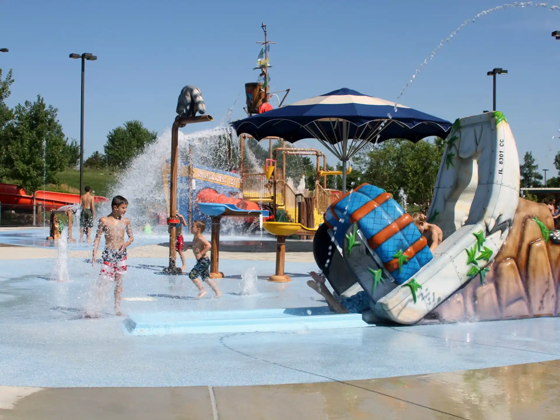 a group of people playing in a water park