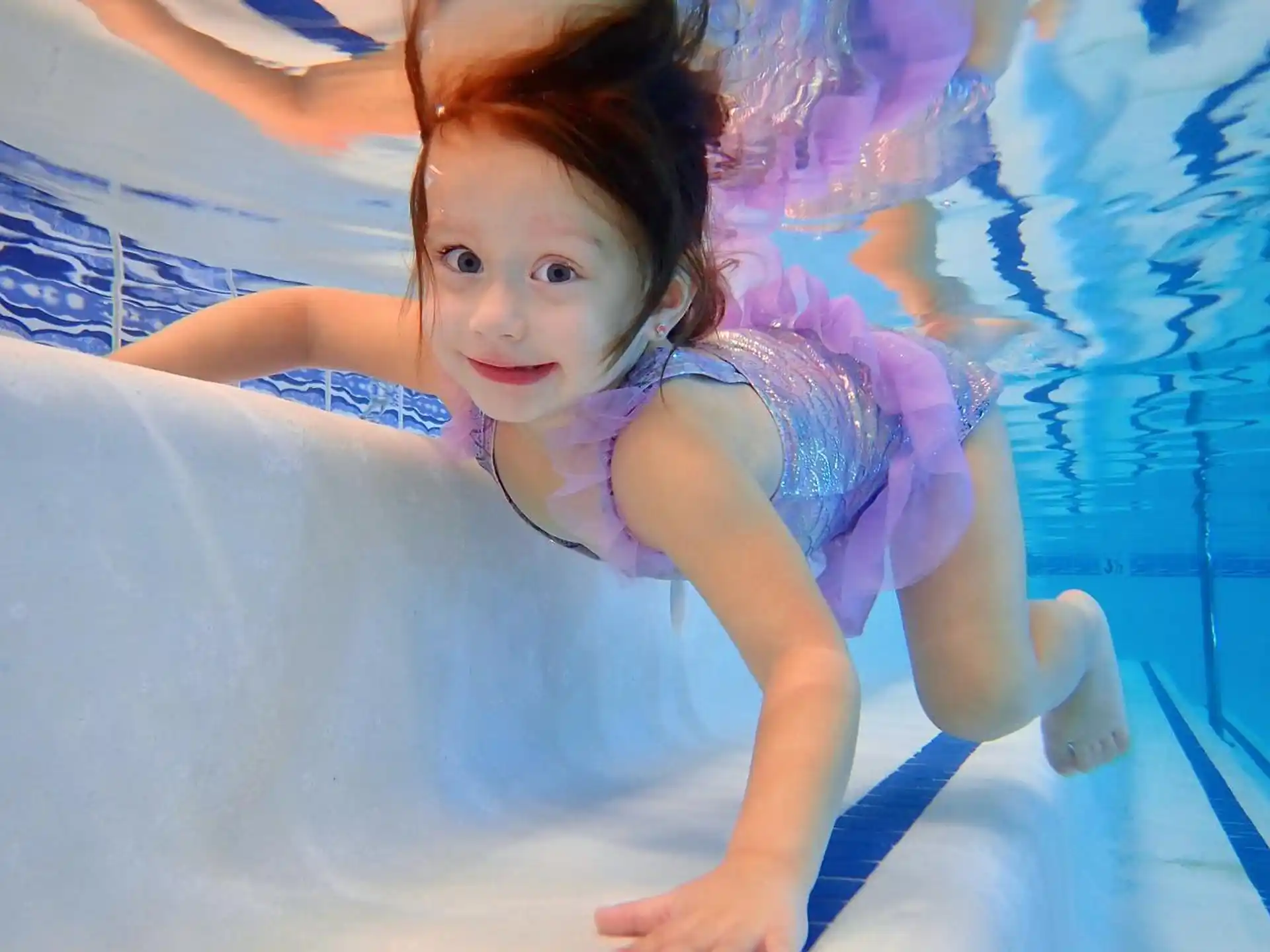 a girl in a pool