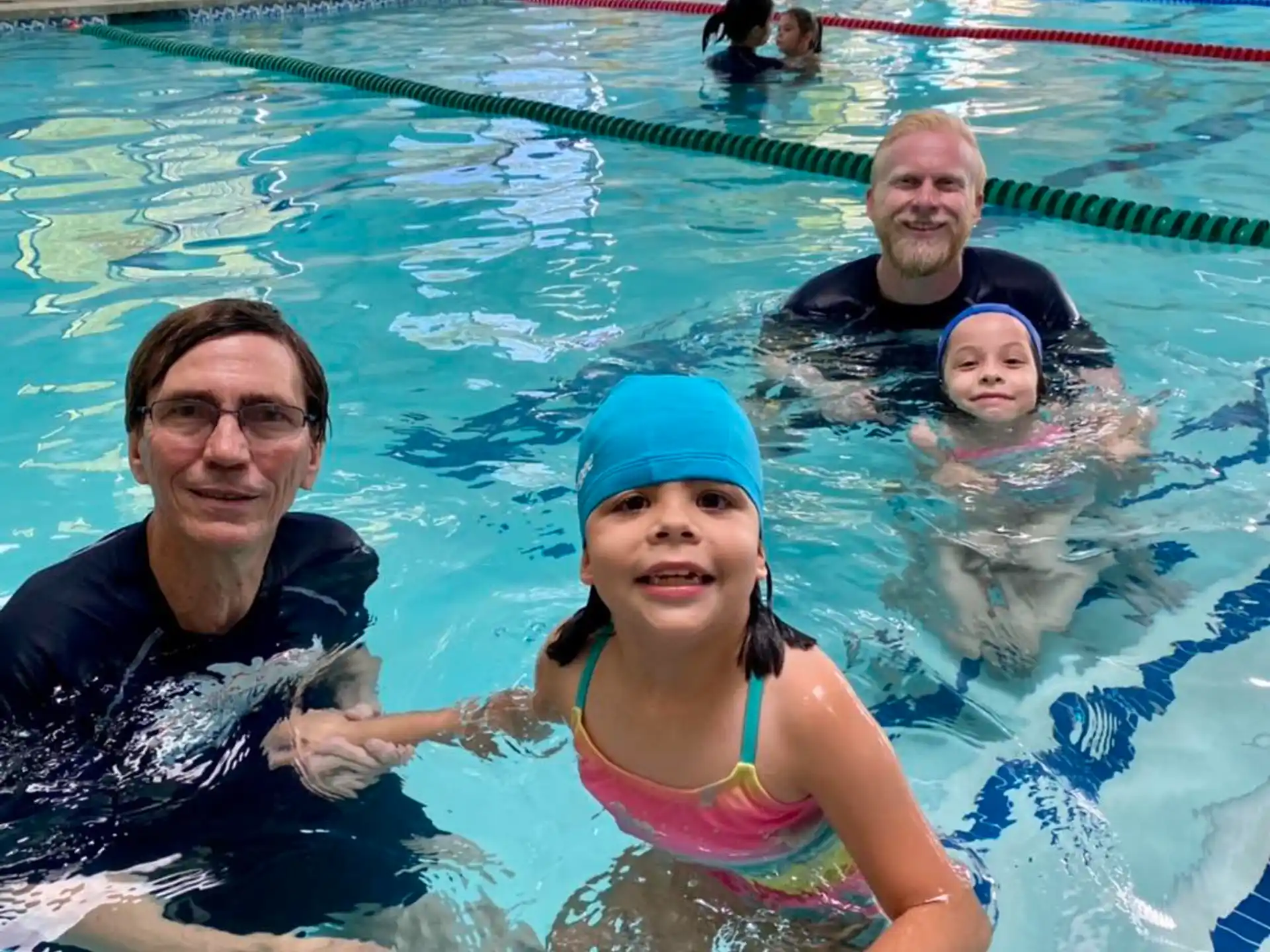 a group of people in a pool
