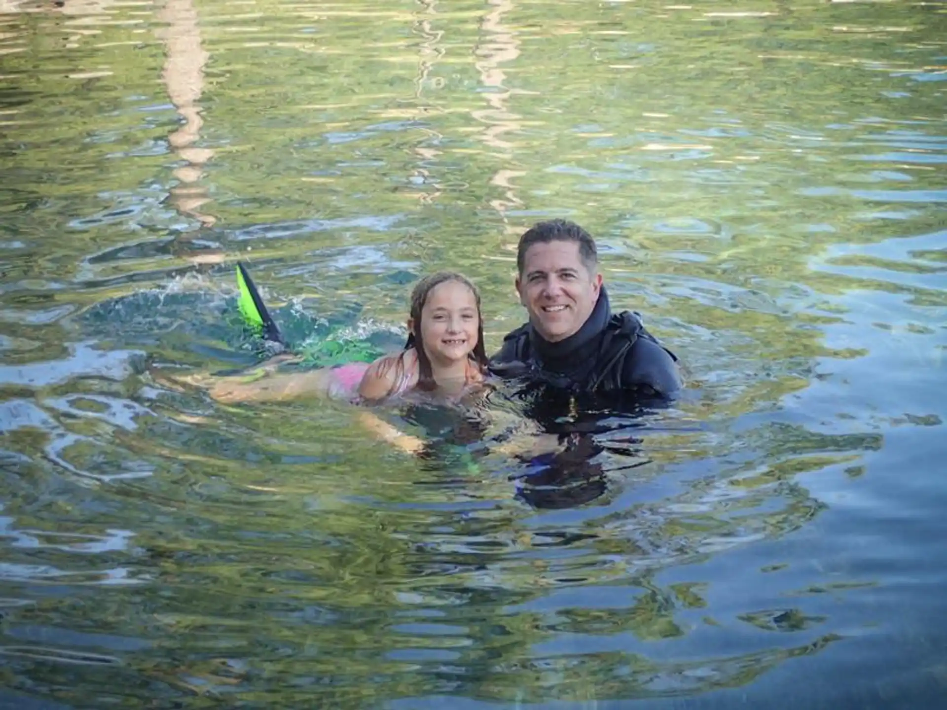 a person and a girl in water