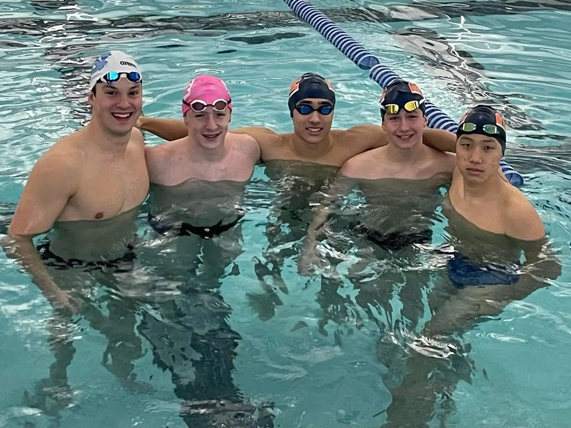 a group of men in a pool