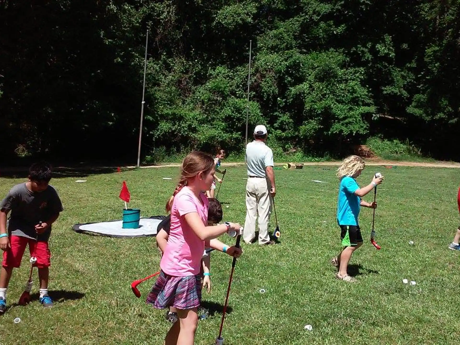 a group of people playing golf