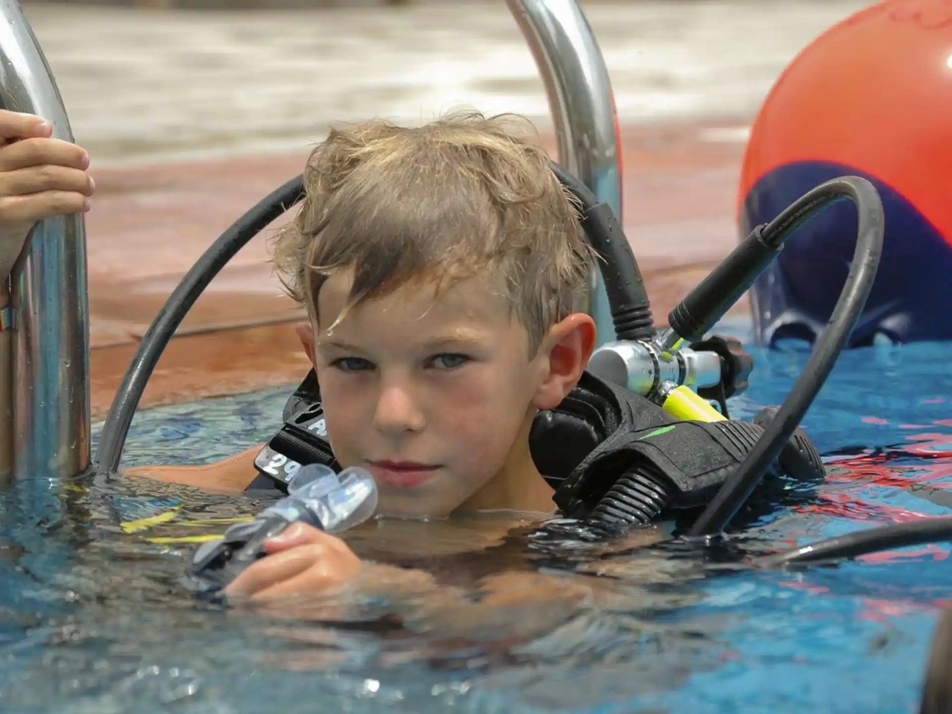a boy in a pool