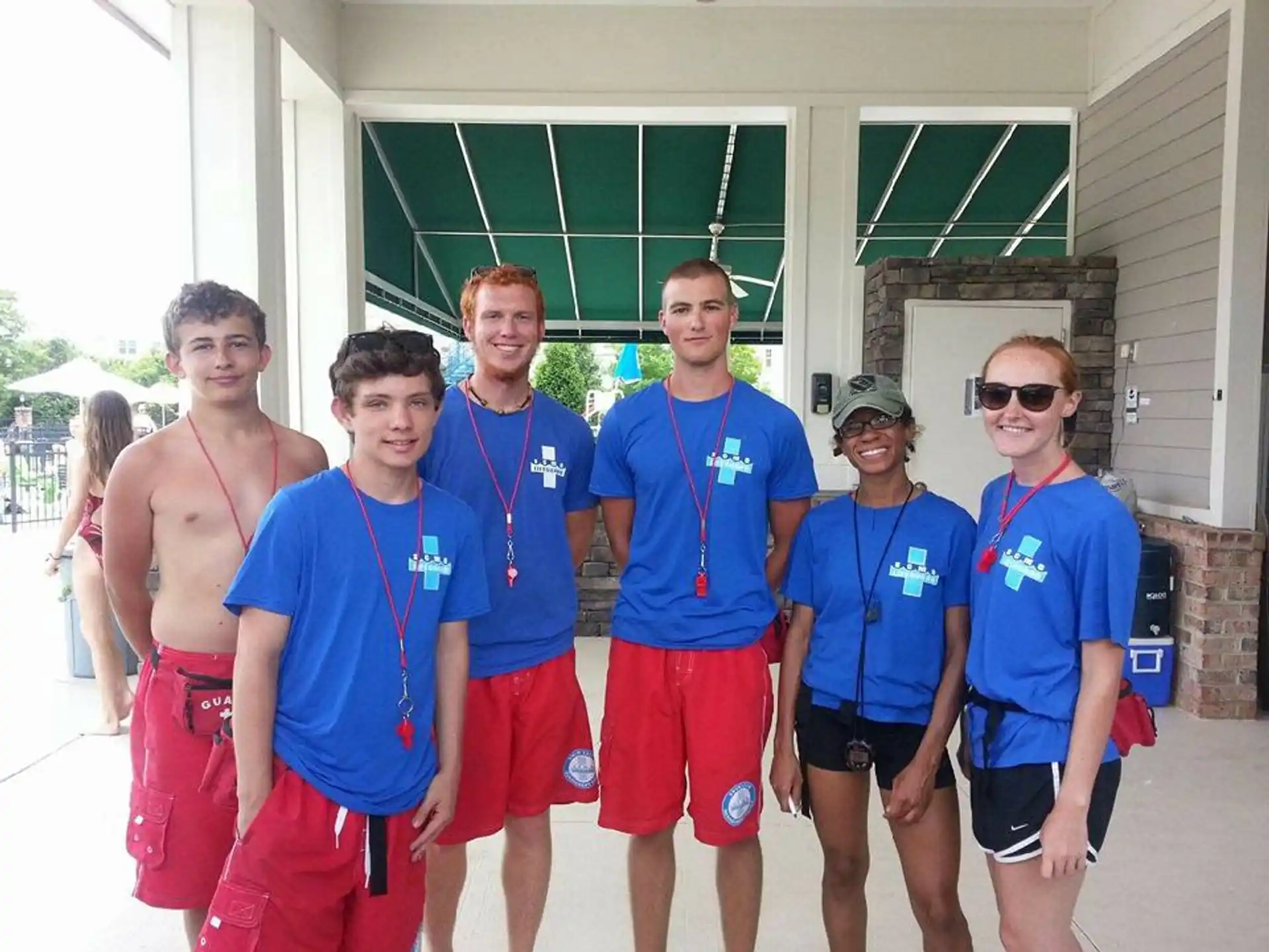 a group of people wearing medals