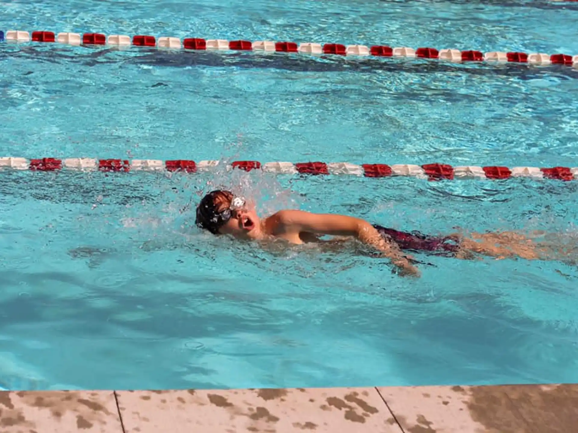 a person swimming in a pool