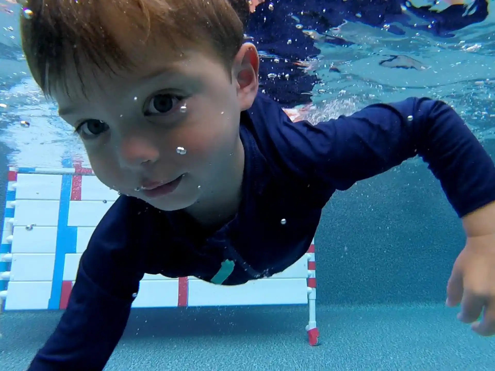 a boy in a pool