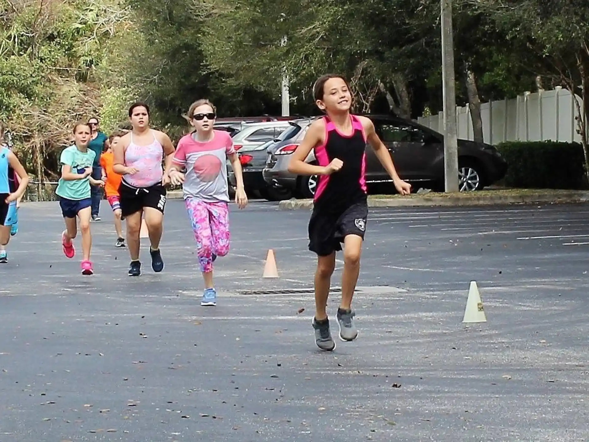 a group of people running on a street