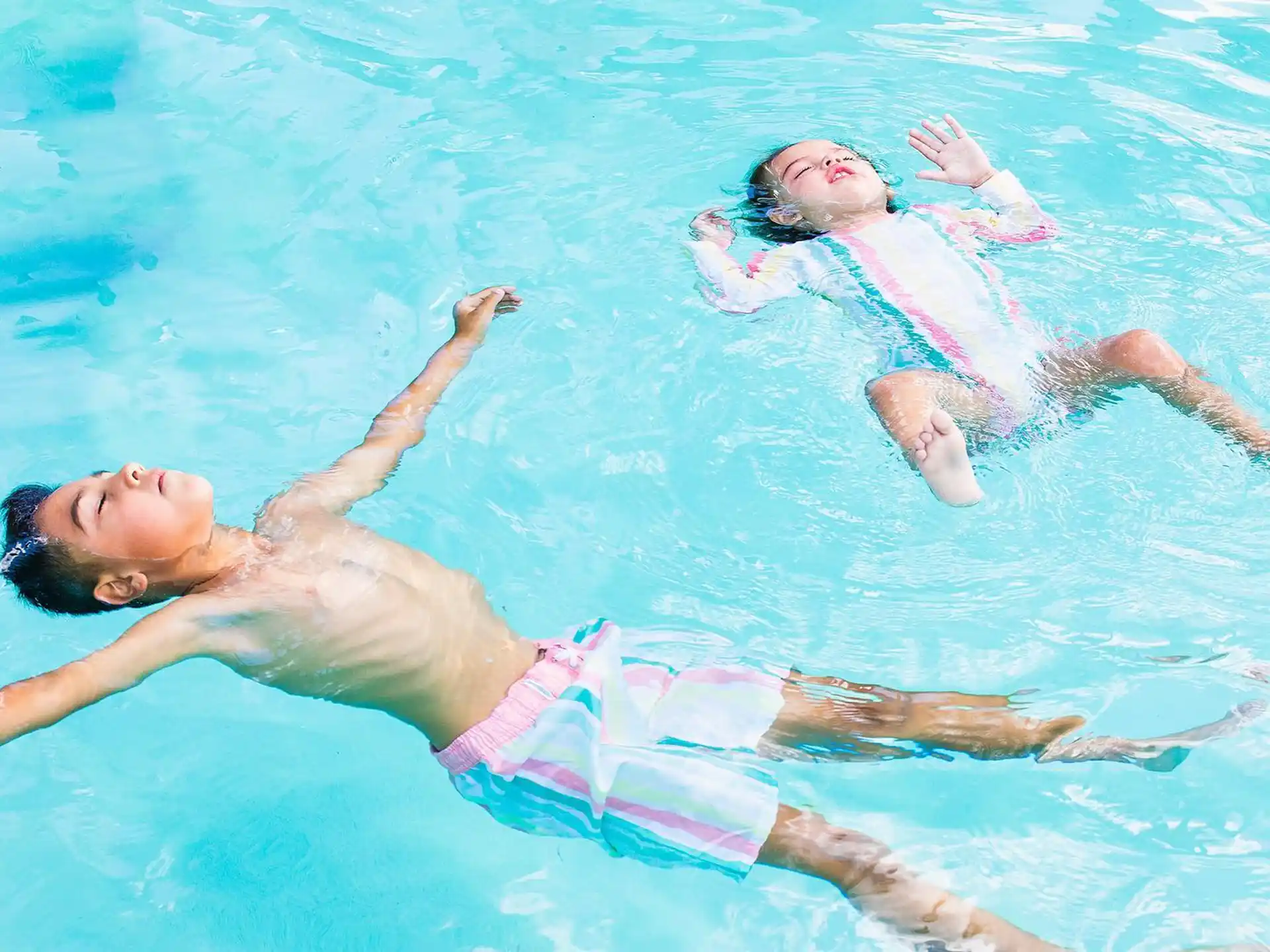 a man and woman in a pool