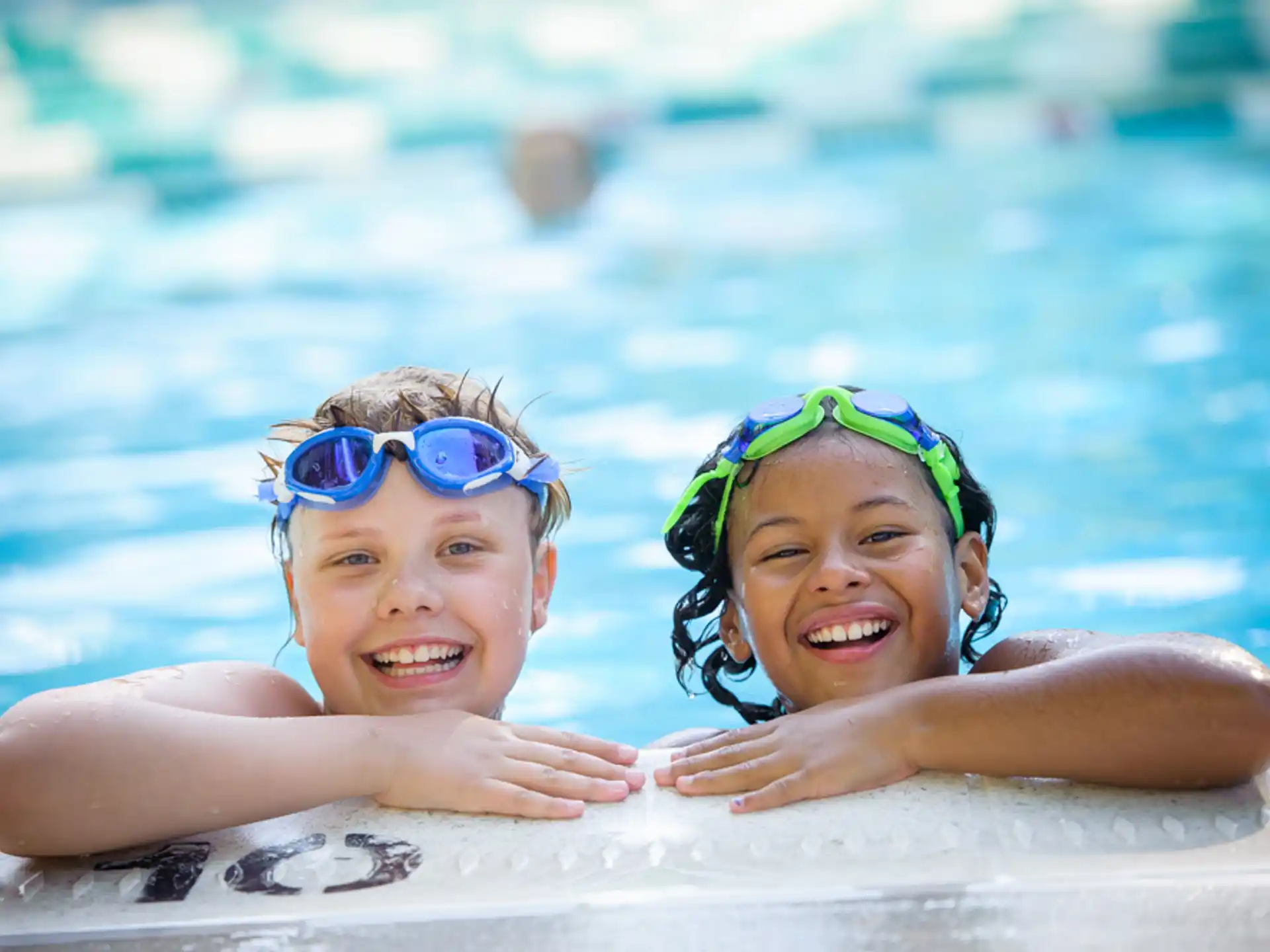 a couple of children in a pool