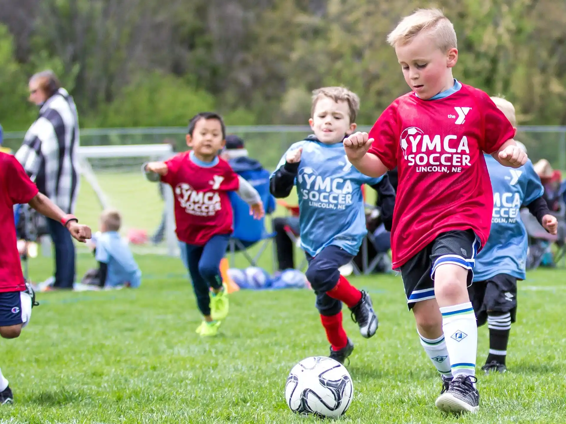kids playing football on a field