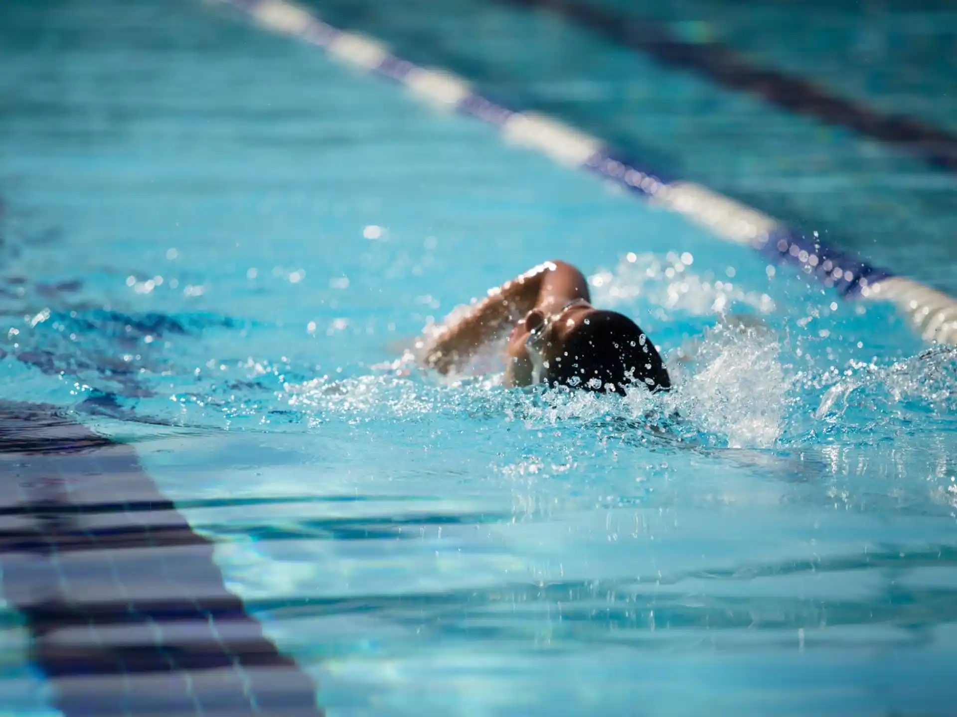 a person swimming in a pool