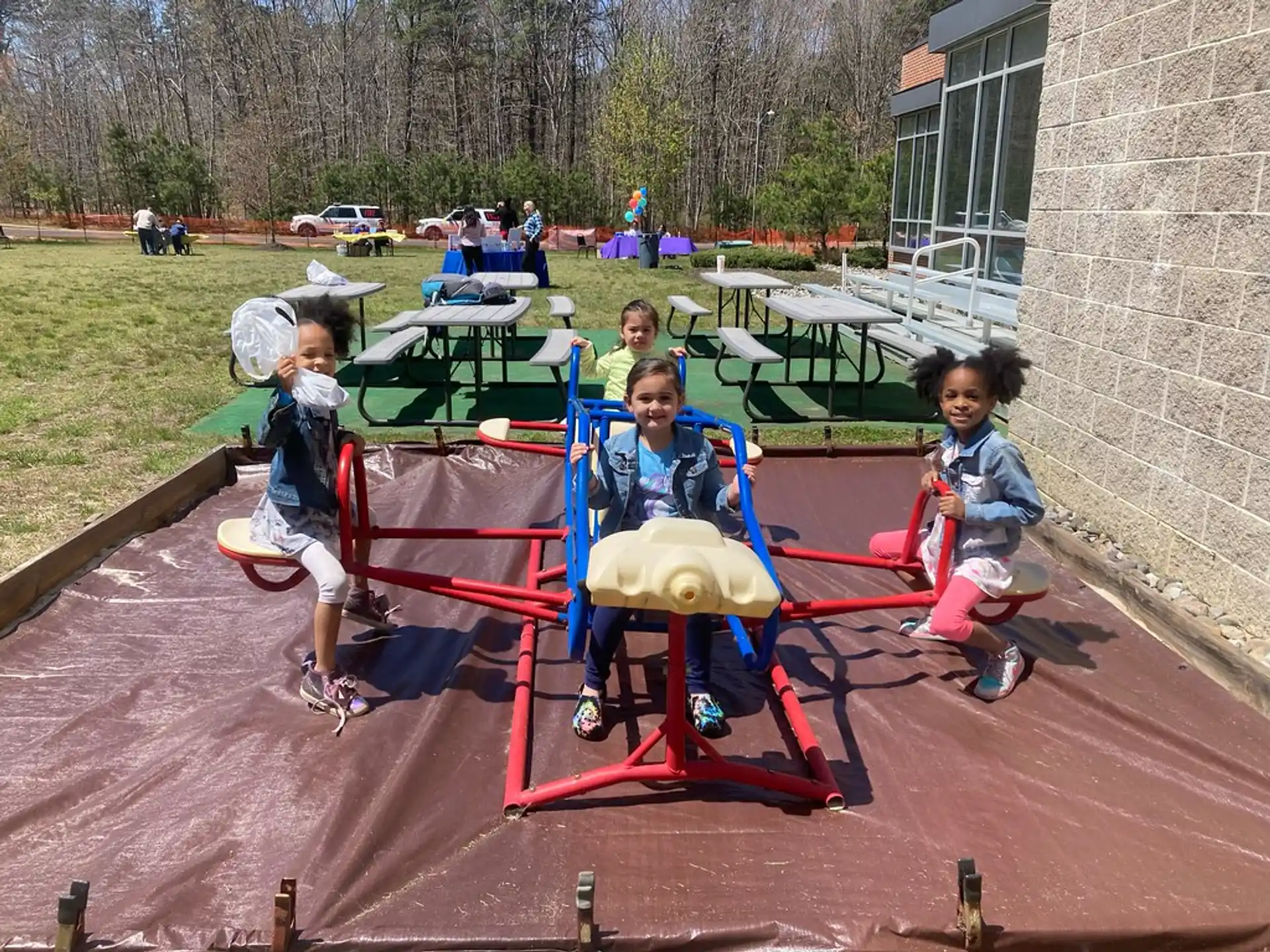 a group of kids playing on a playground