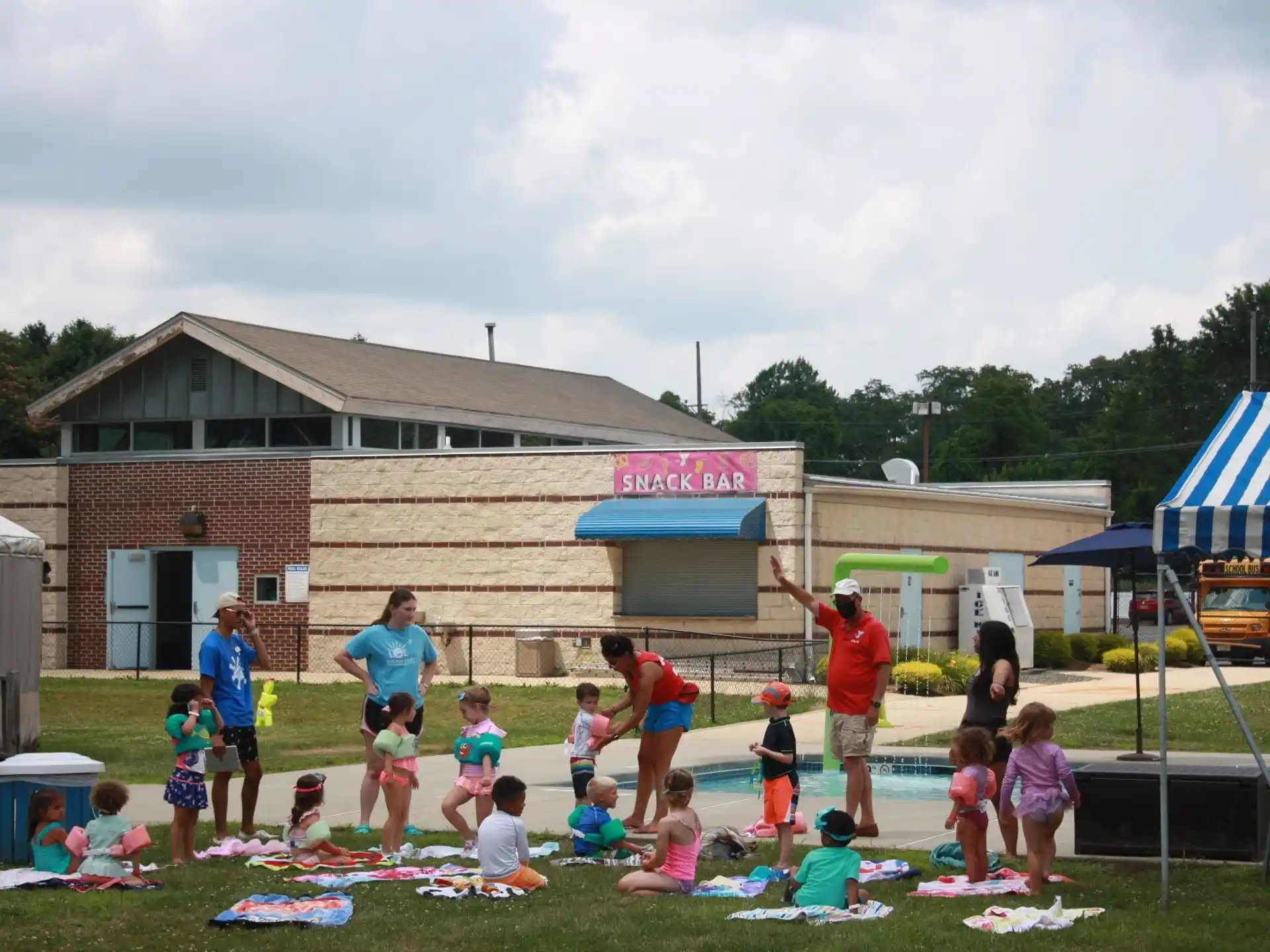 a group of people playing in a yard