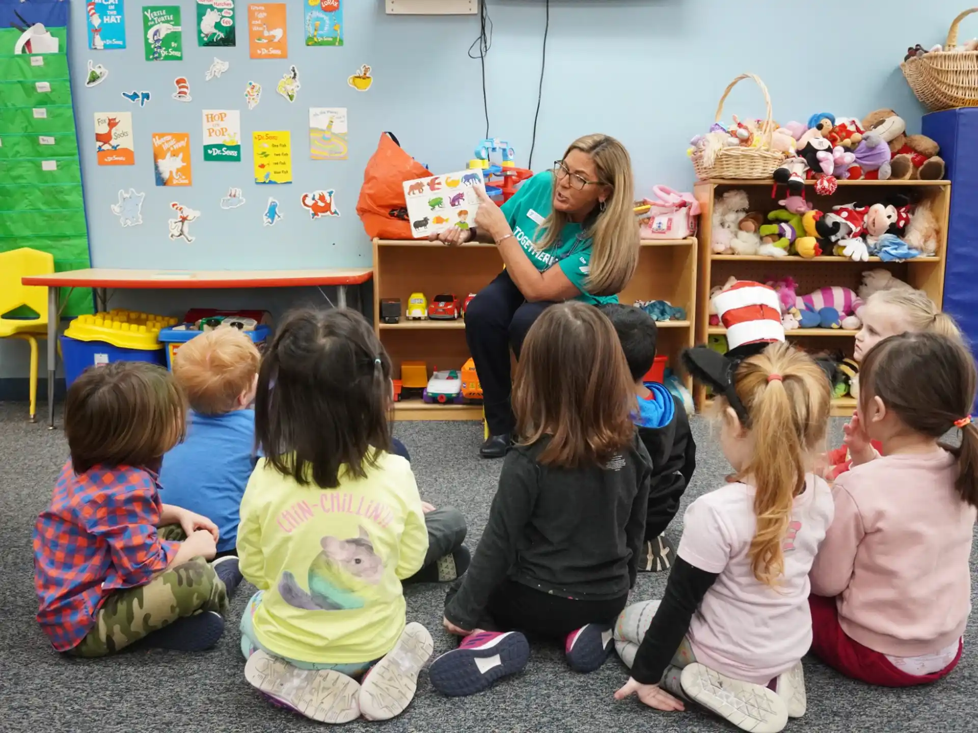 a person teaching children in a classroom