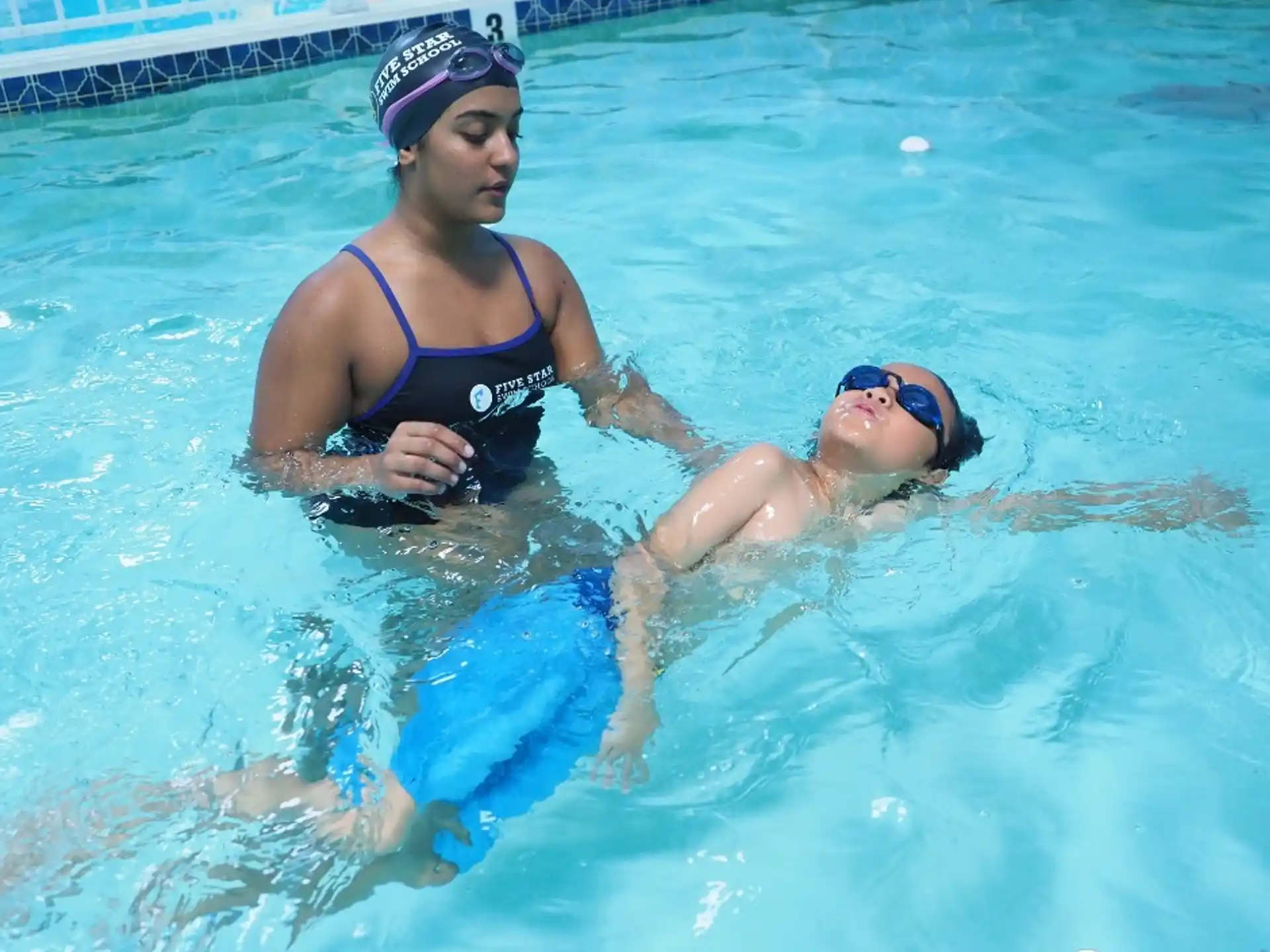 a woman and a man in a pool