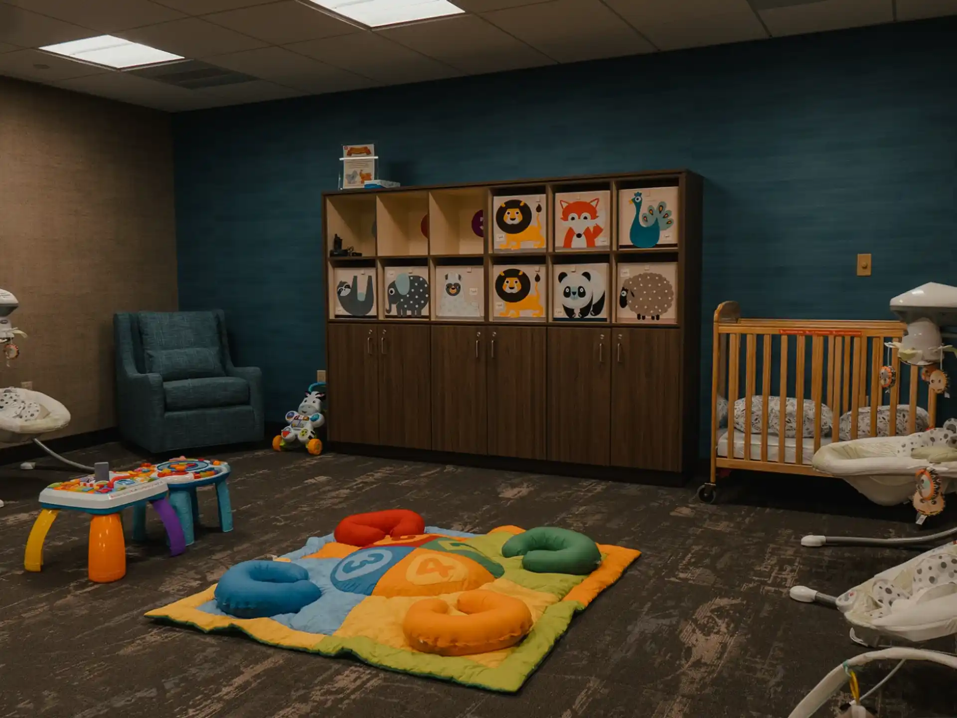 a room with toys and a baby crib