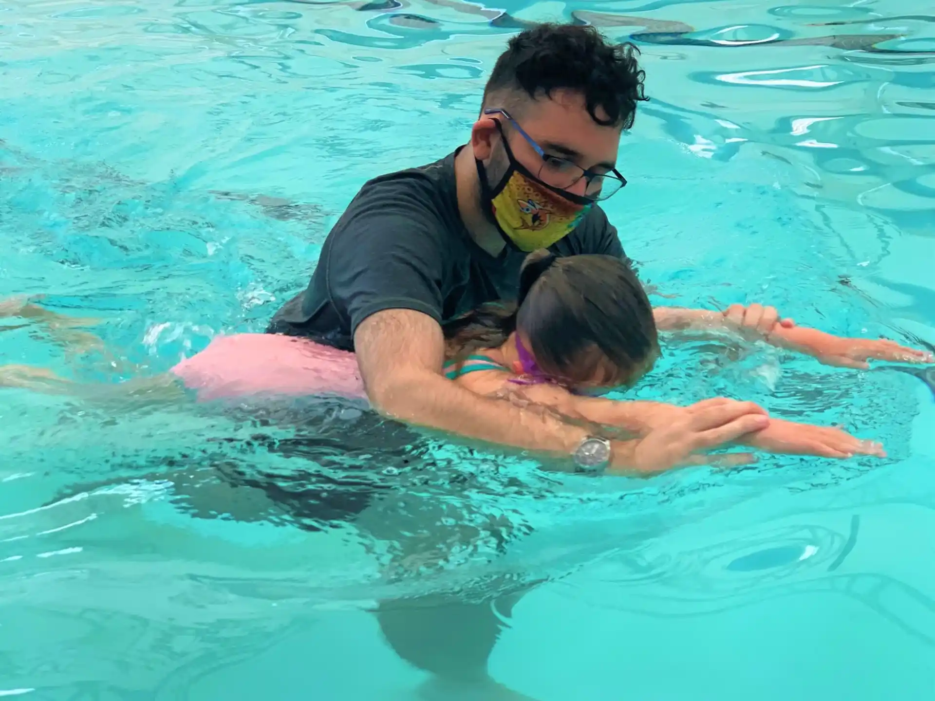 a man and a woman in a pool