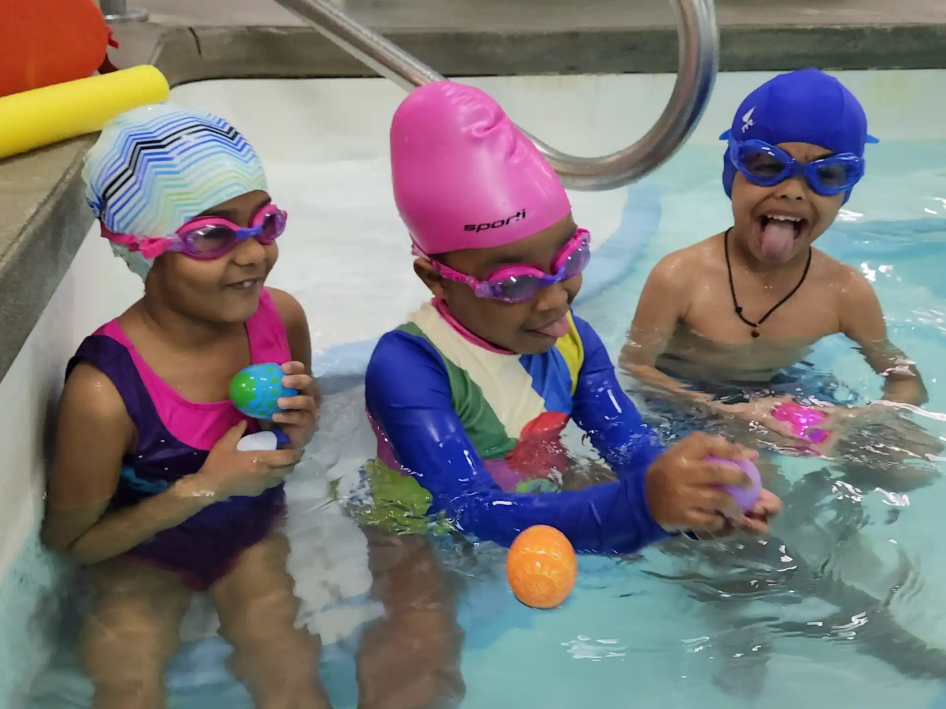 a group of kids in a pool