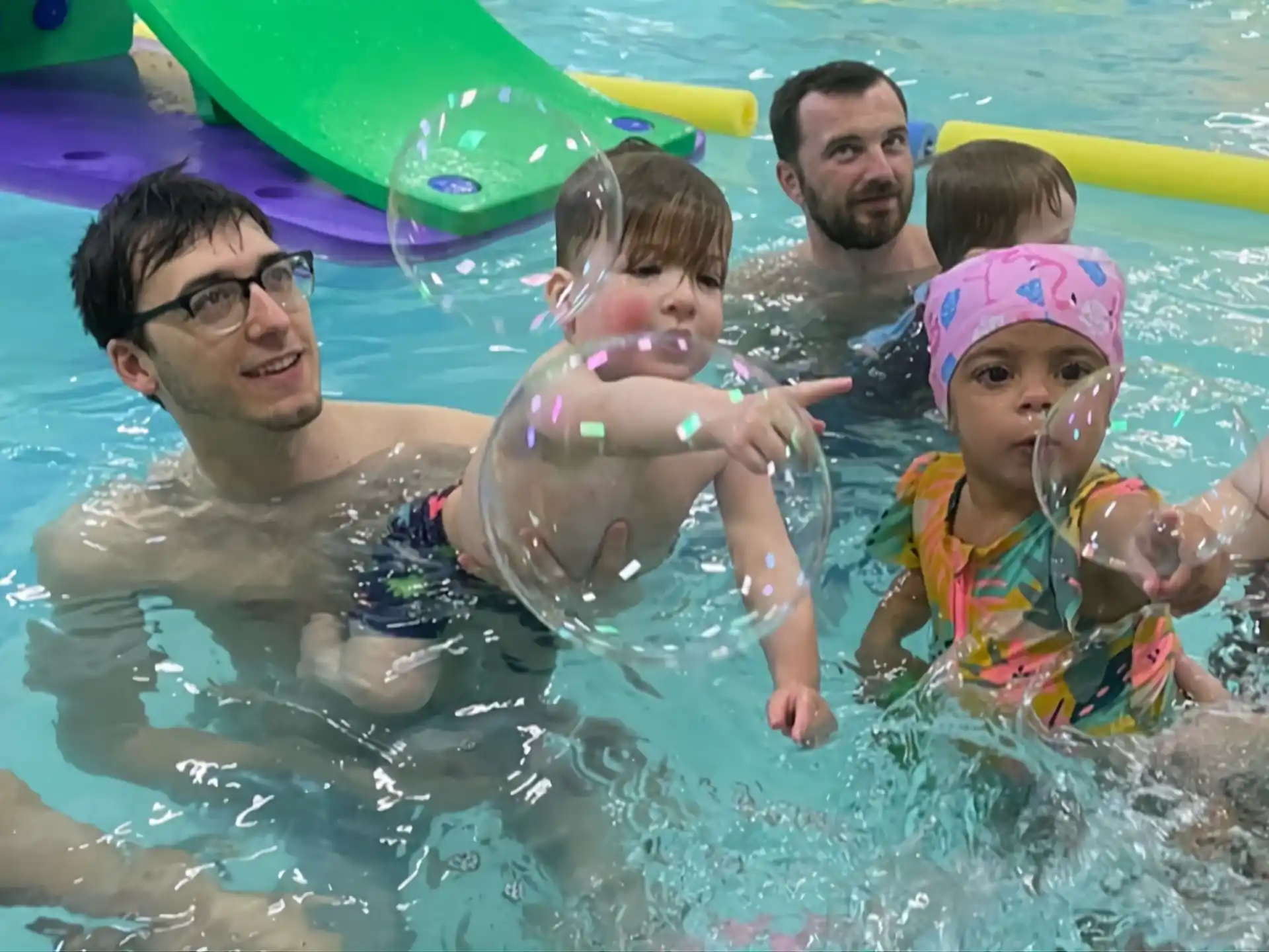 a group of people in a pool