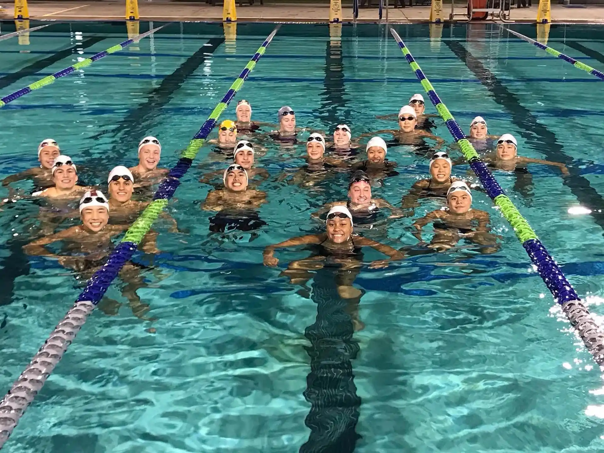 a group of people in a pool