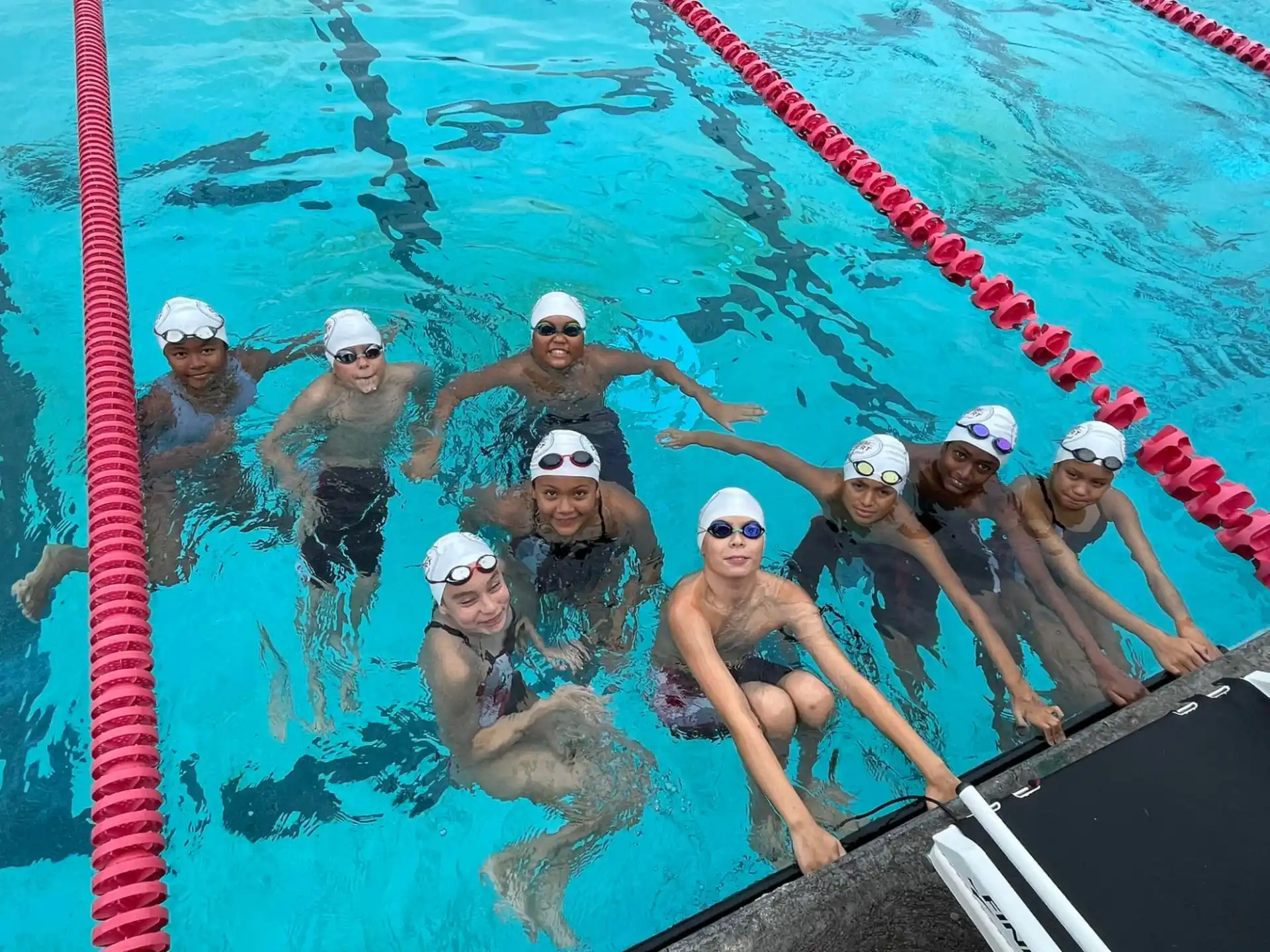 a group of people in a pool