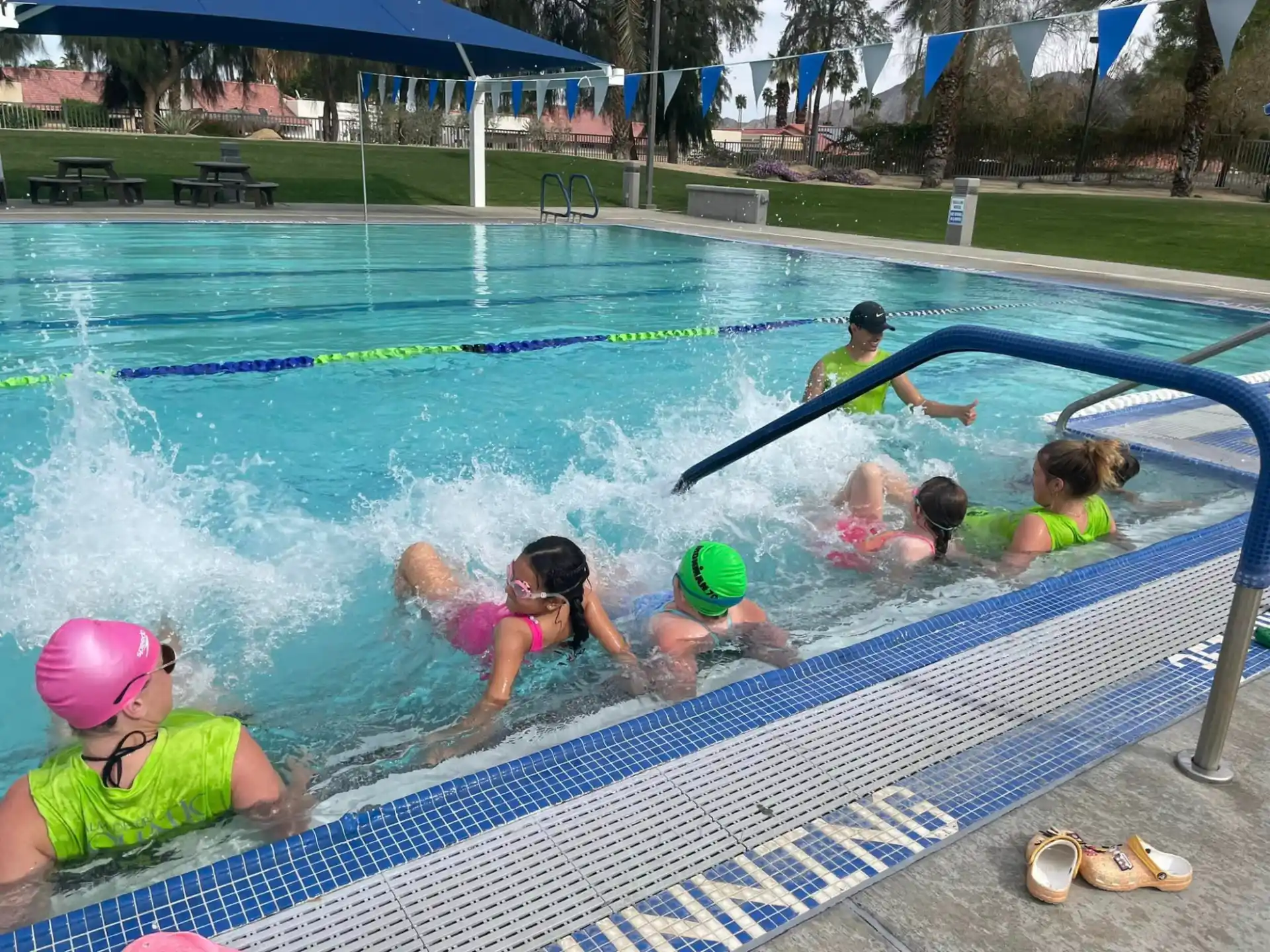 a group of kids in a pool