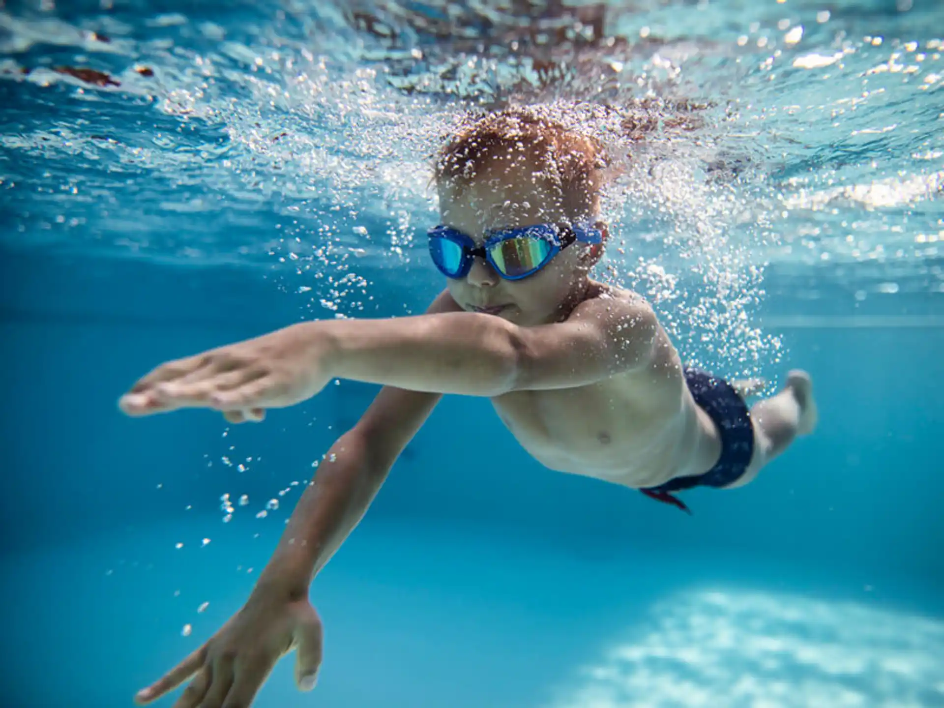 a person swimming in a pool