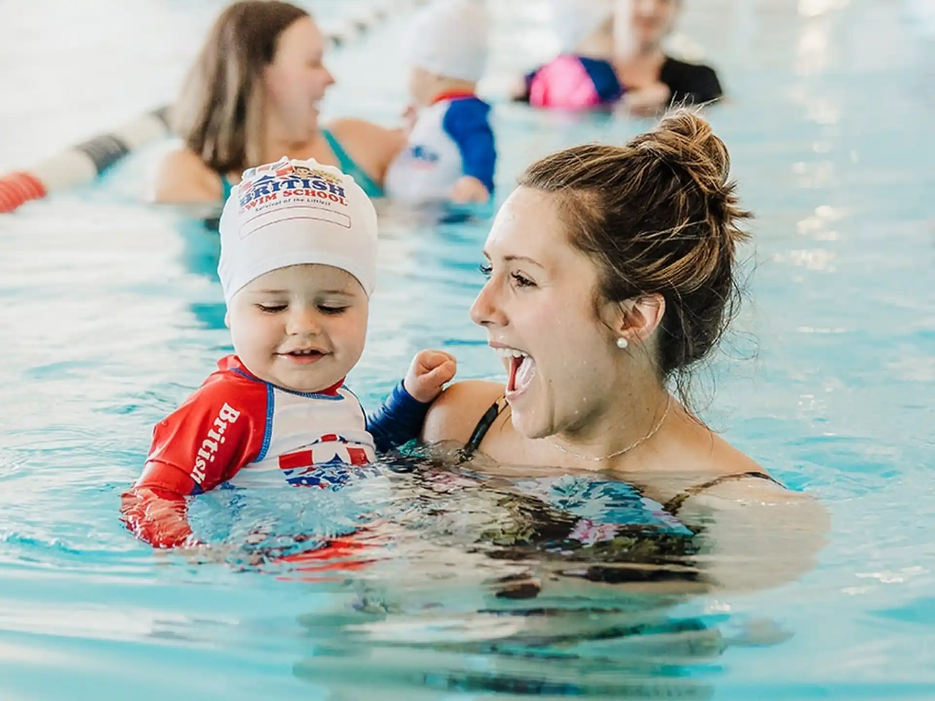 a person and a child in a pool
