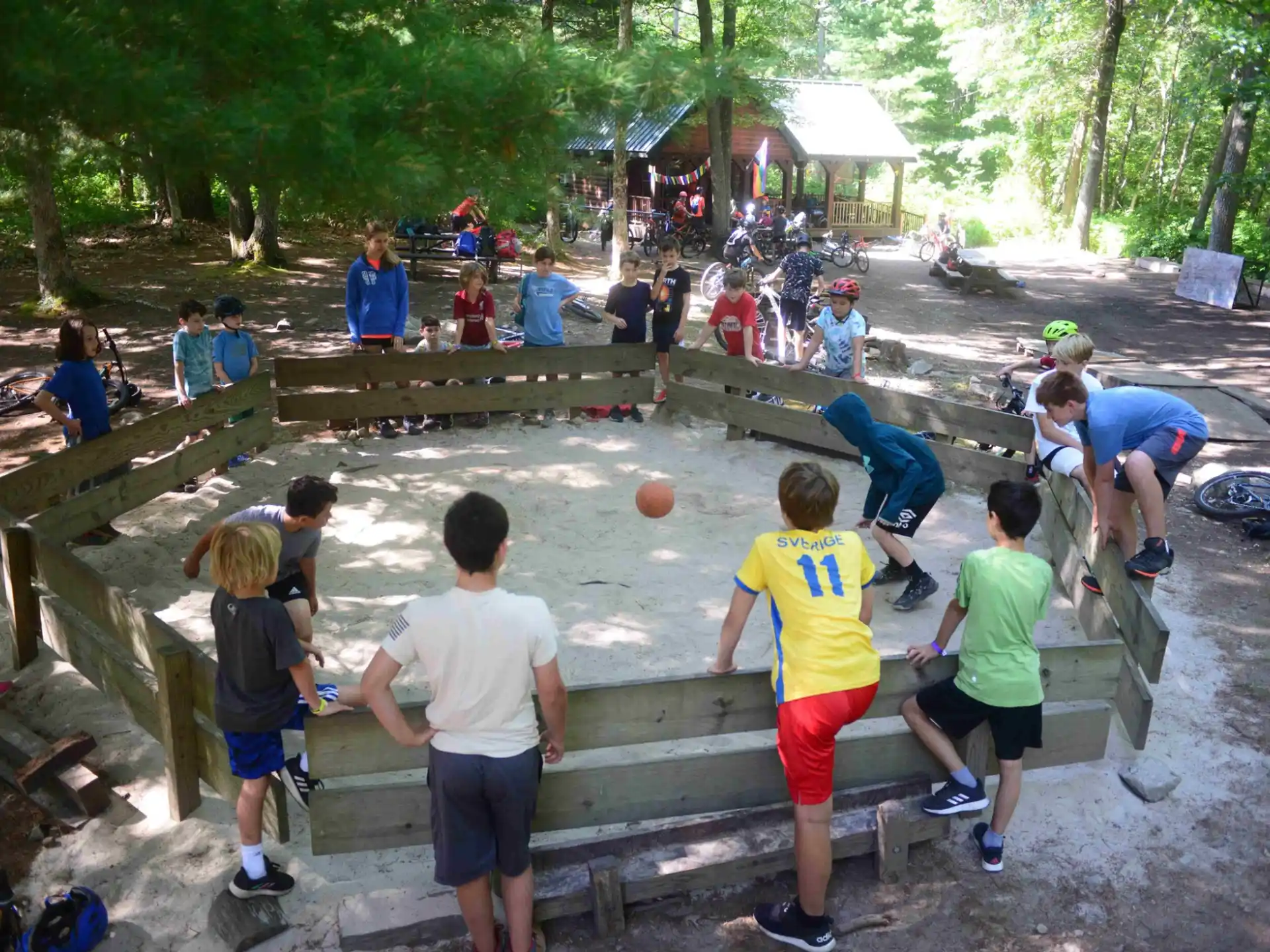 a group of people playing basketball