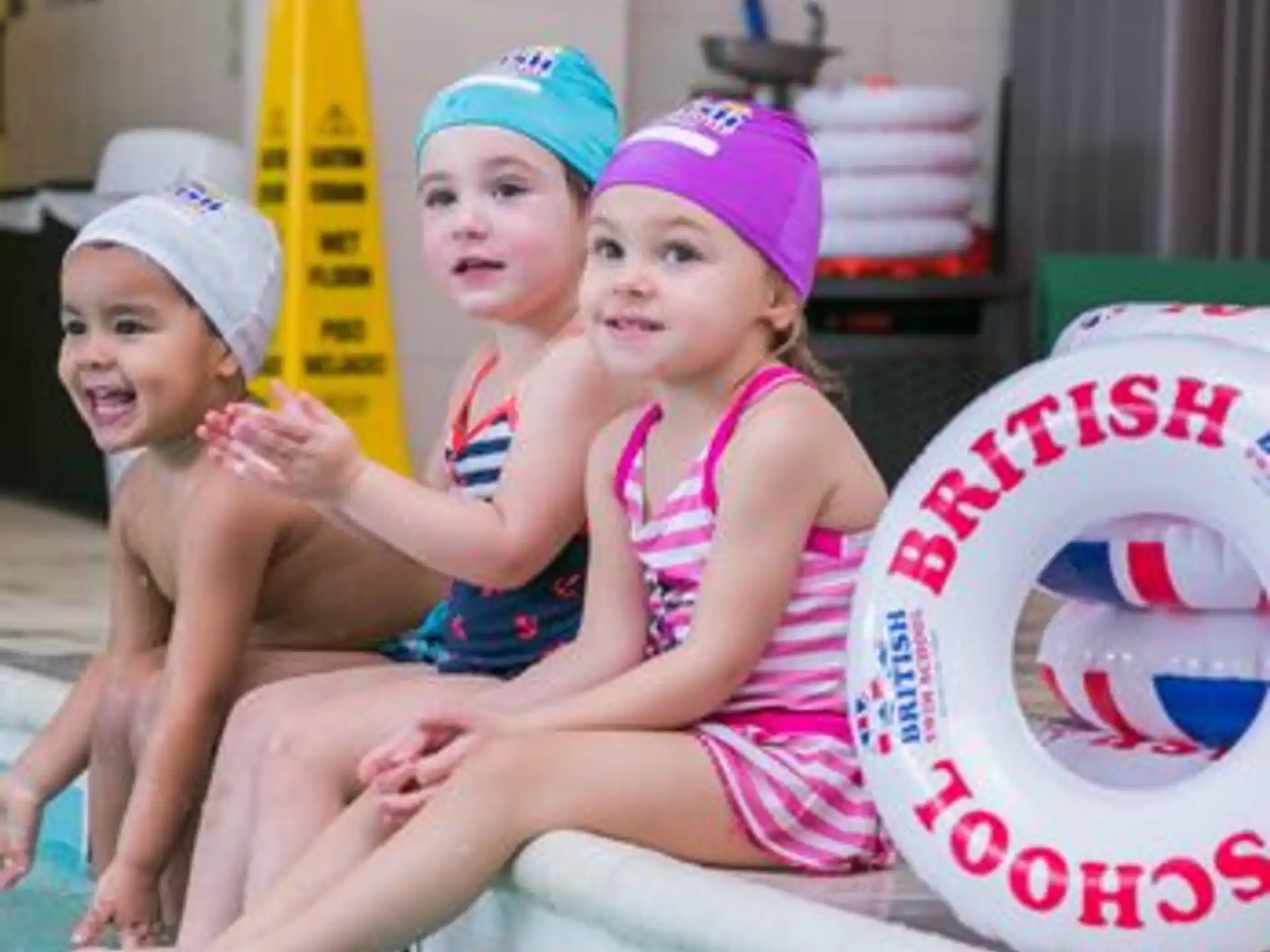 a group of kids in a pool