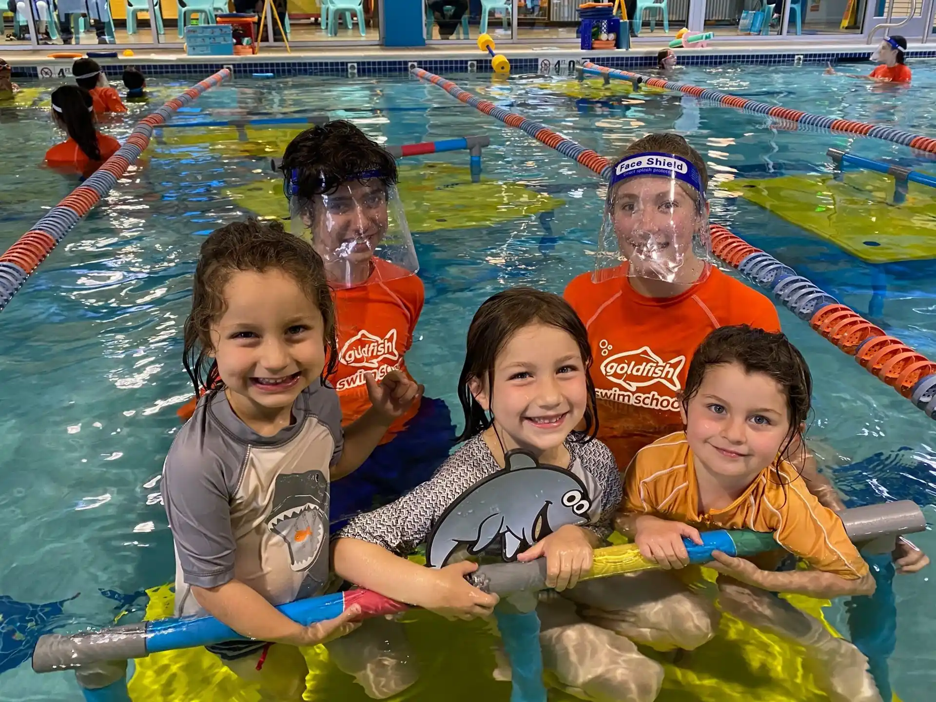 a group of kids in a pool