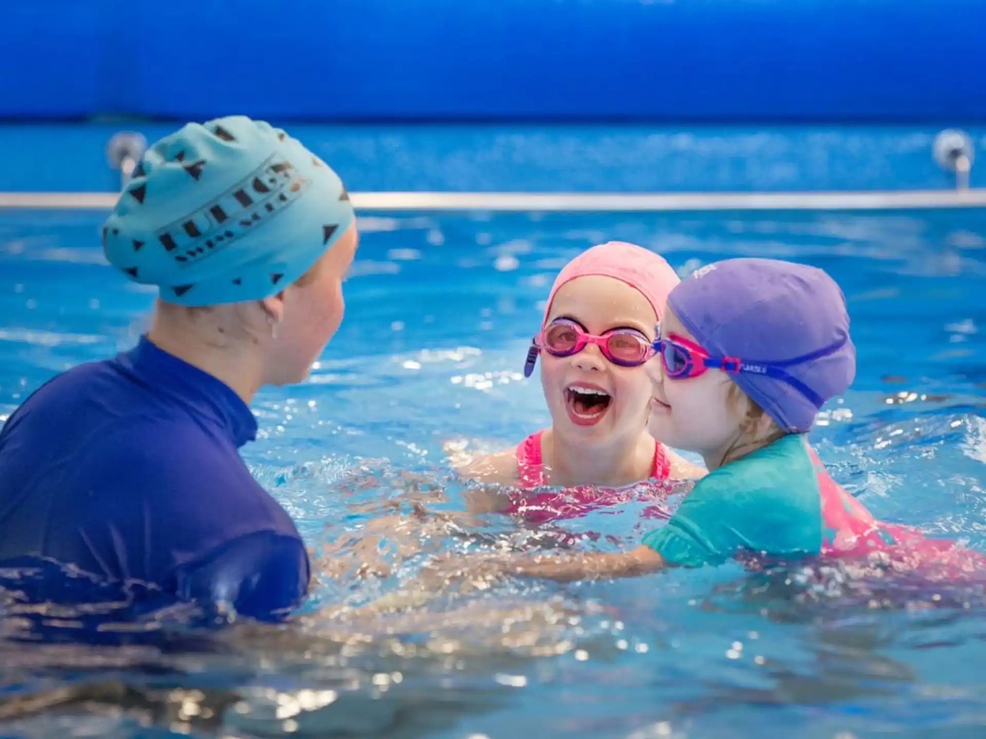 a group of kids in a pool