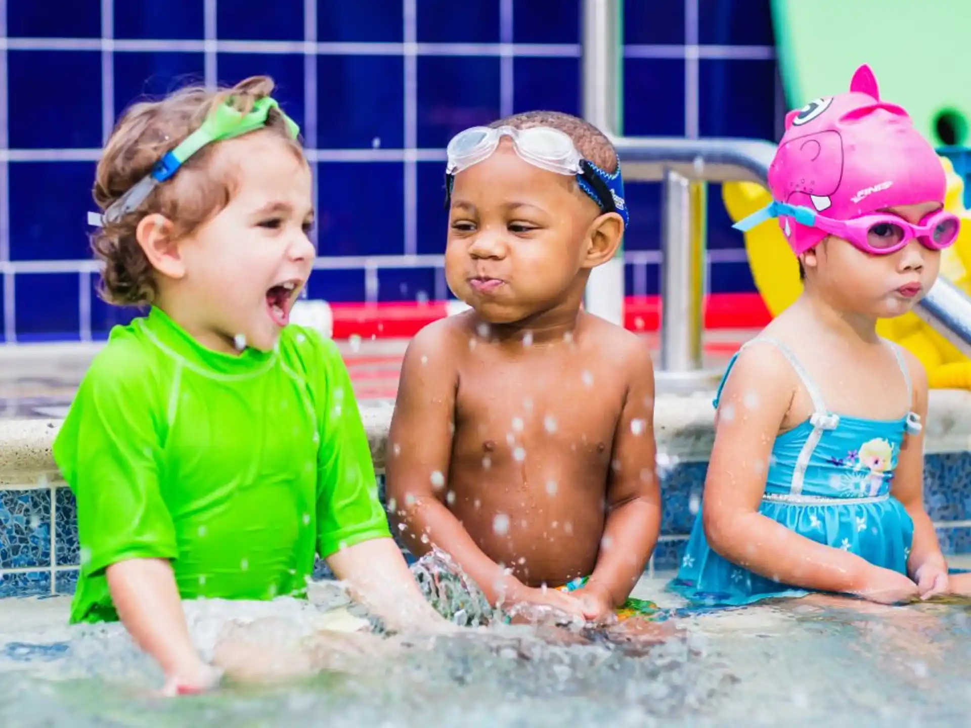 a group of children in a pool