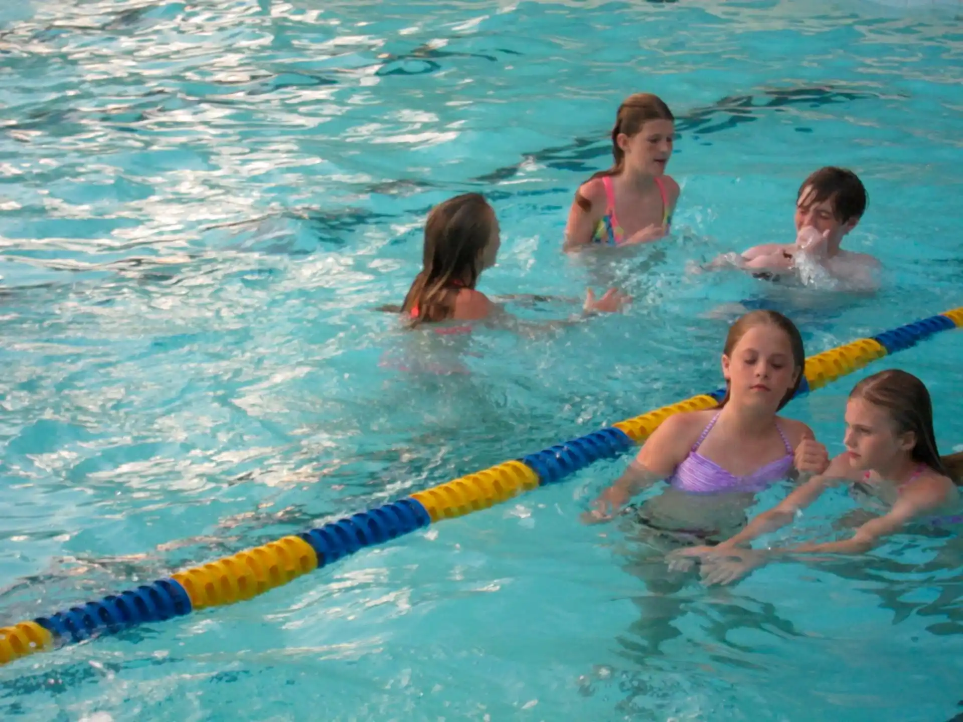 a group of people in a pool