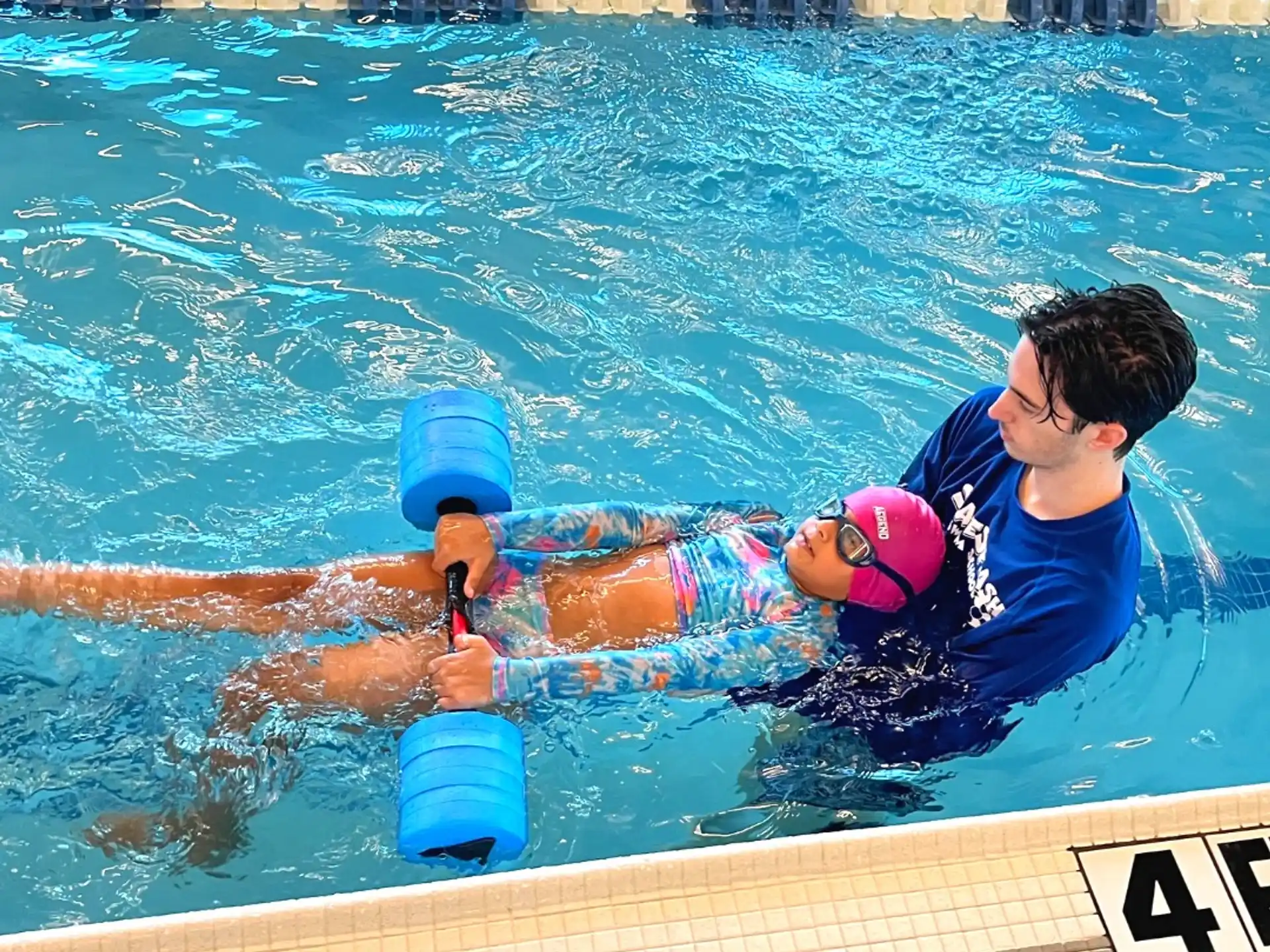 a man and a woman in a pool
