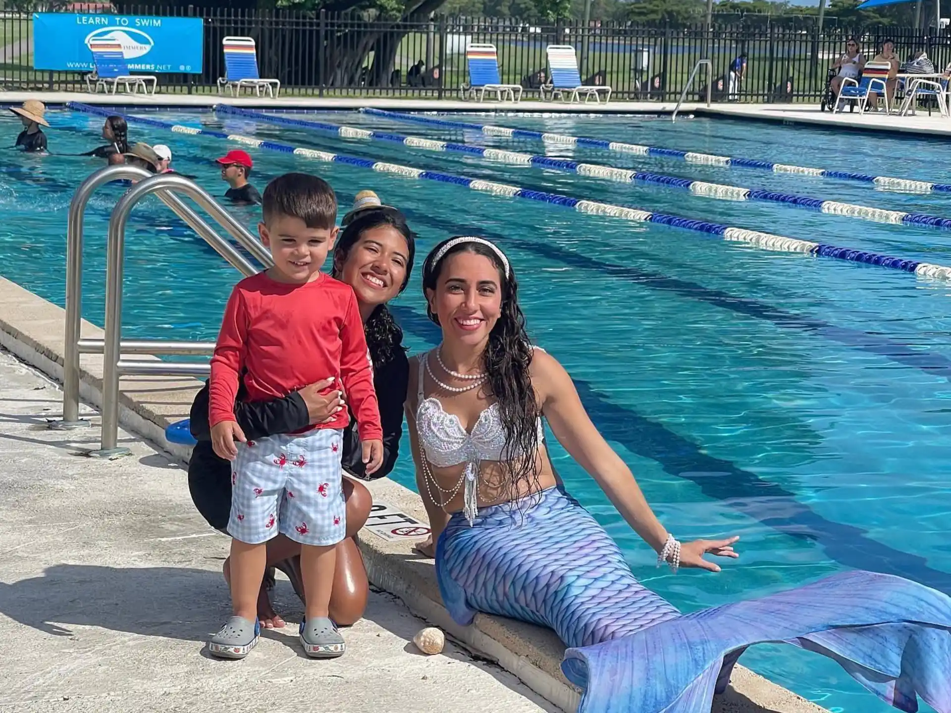 a person and two children by a pool