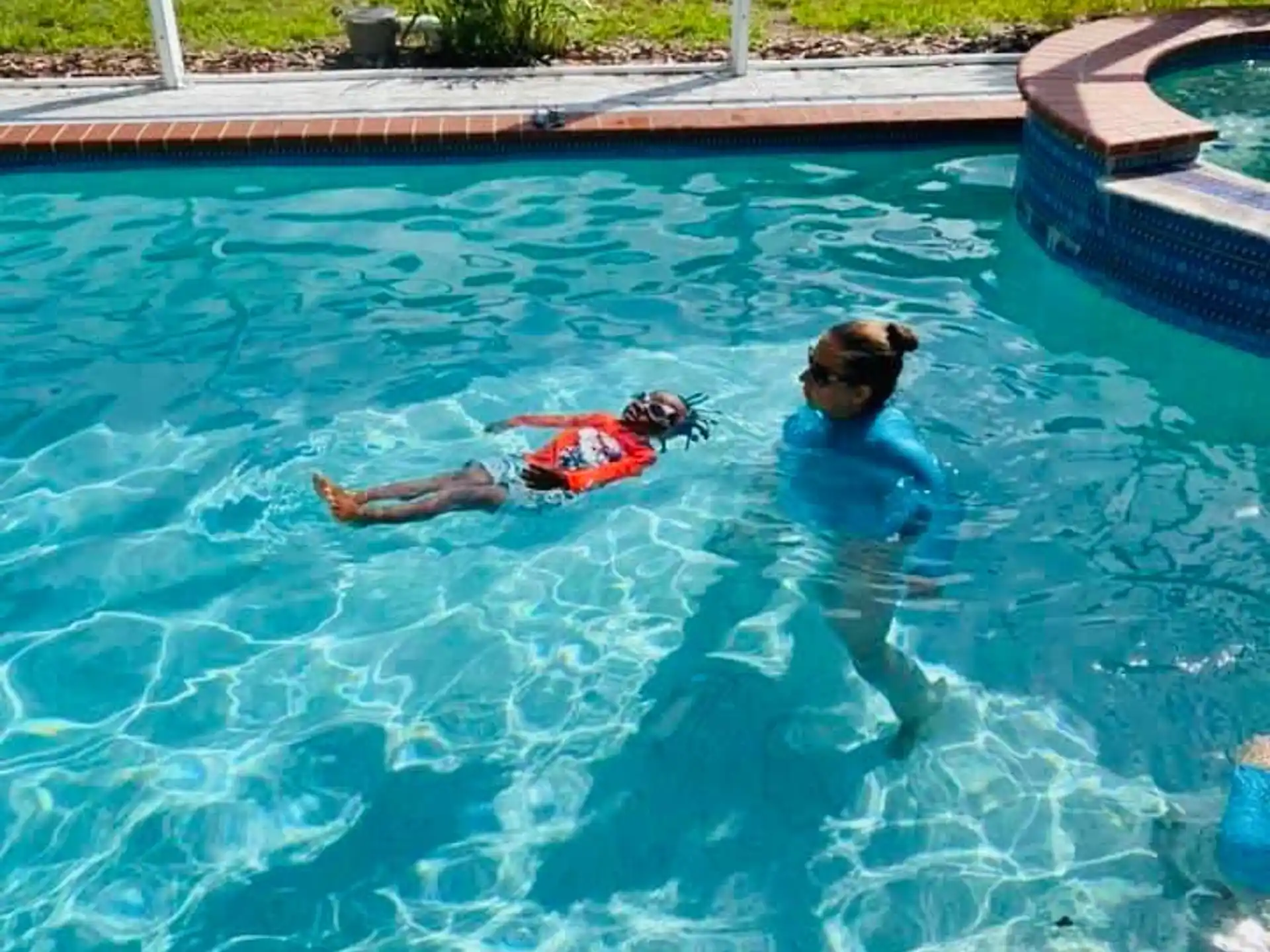 a couple people in a pool