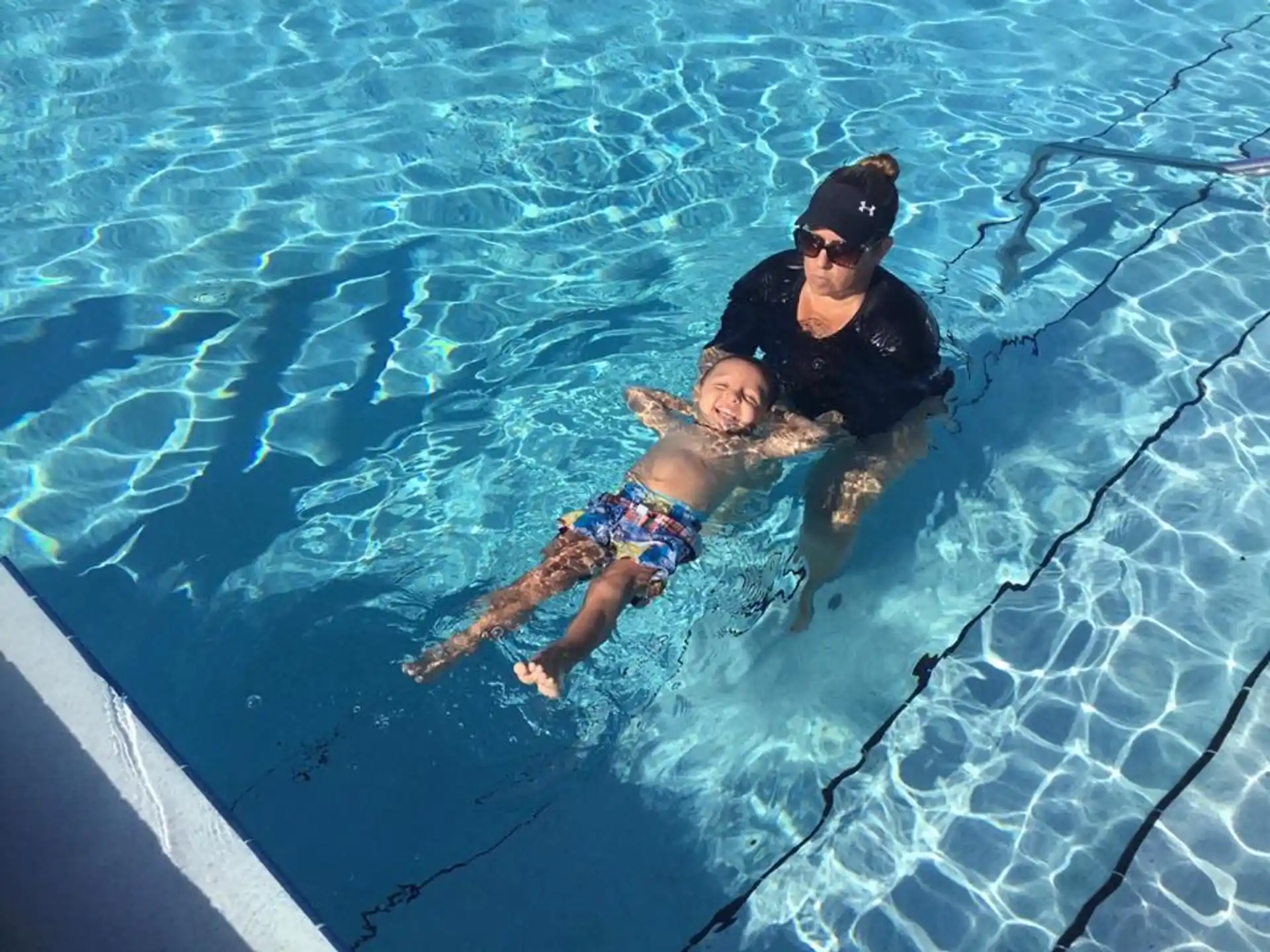 a man and a woman in a pool