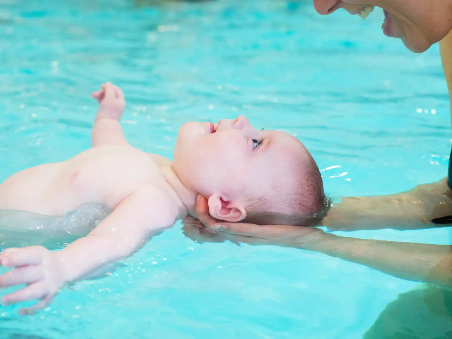 a baby in a pool