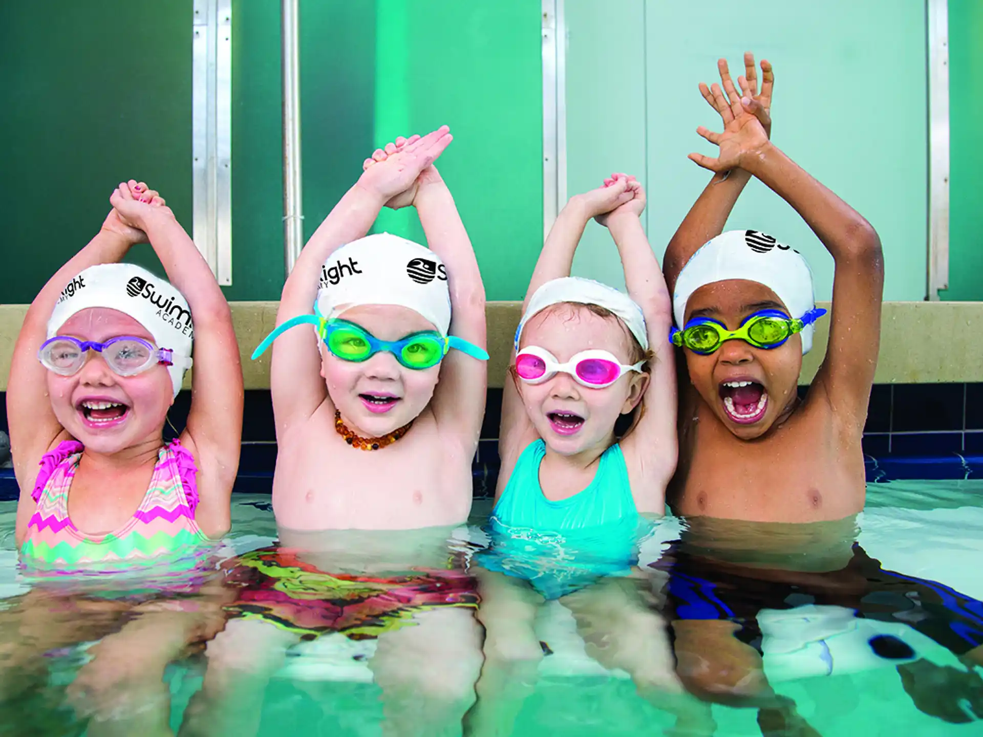 a group of children in a pool