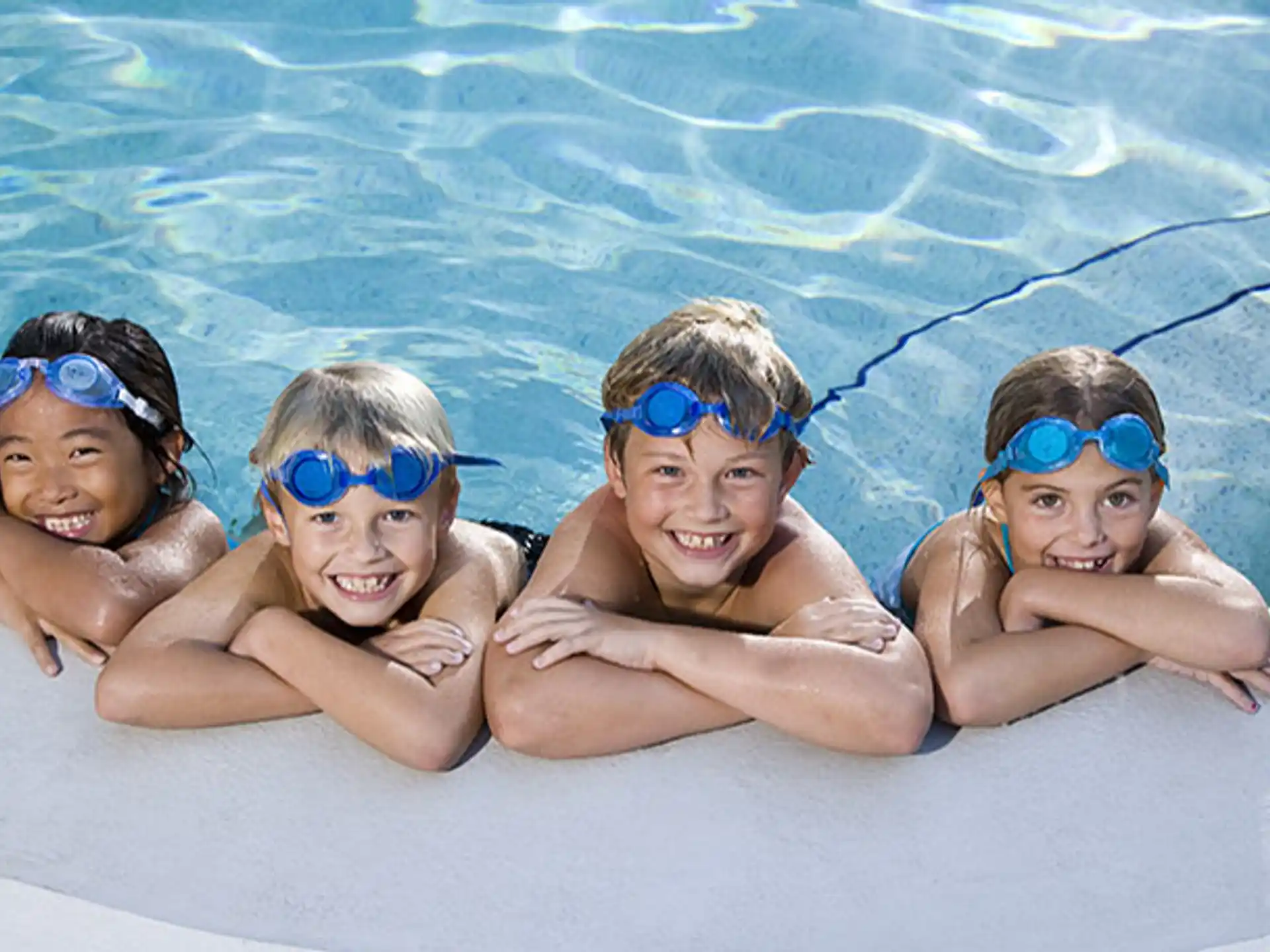 a group of kids in a pool