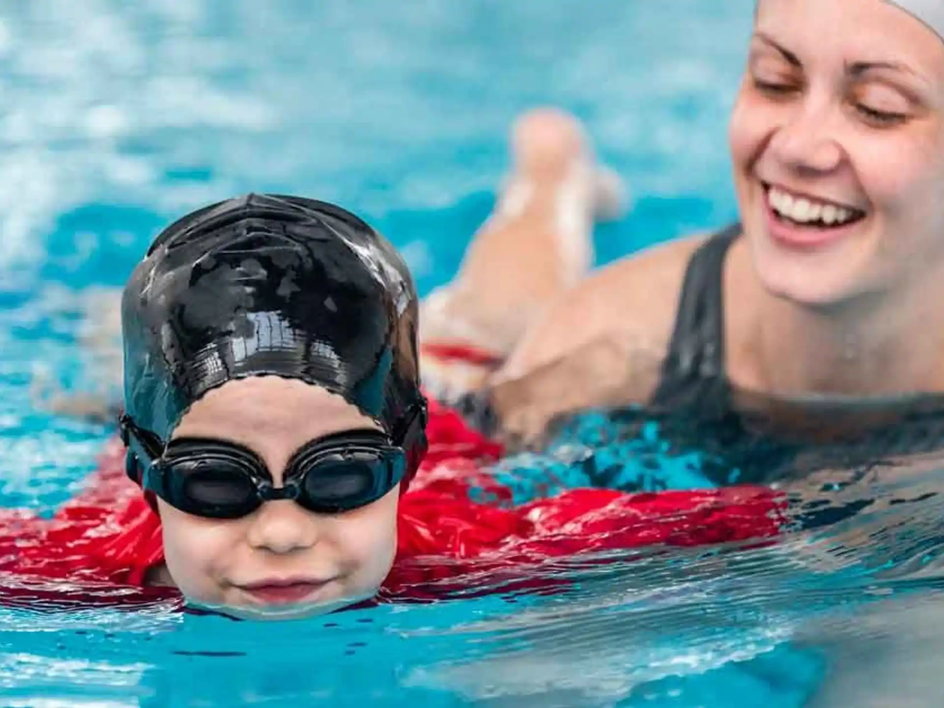 a man and a woman in a pool