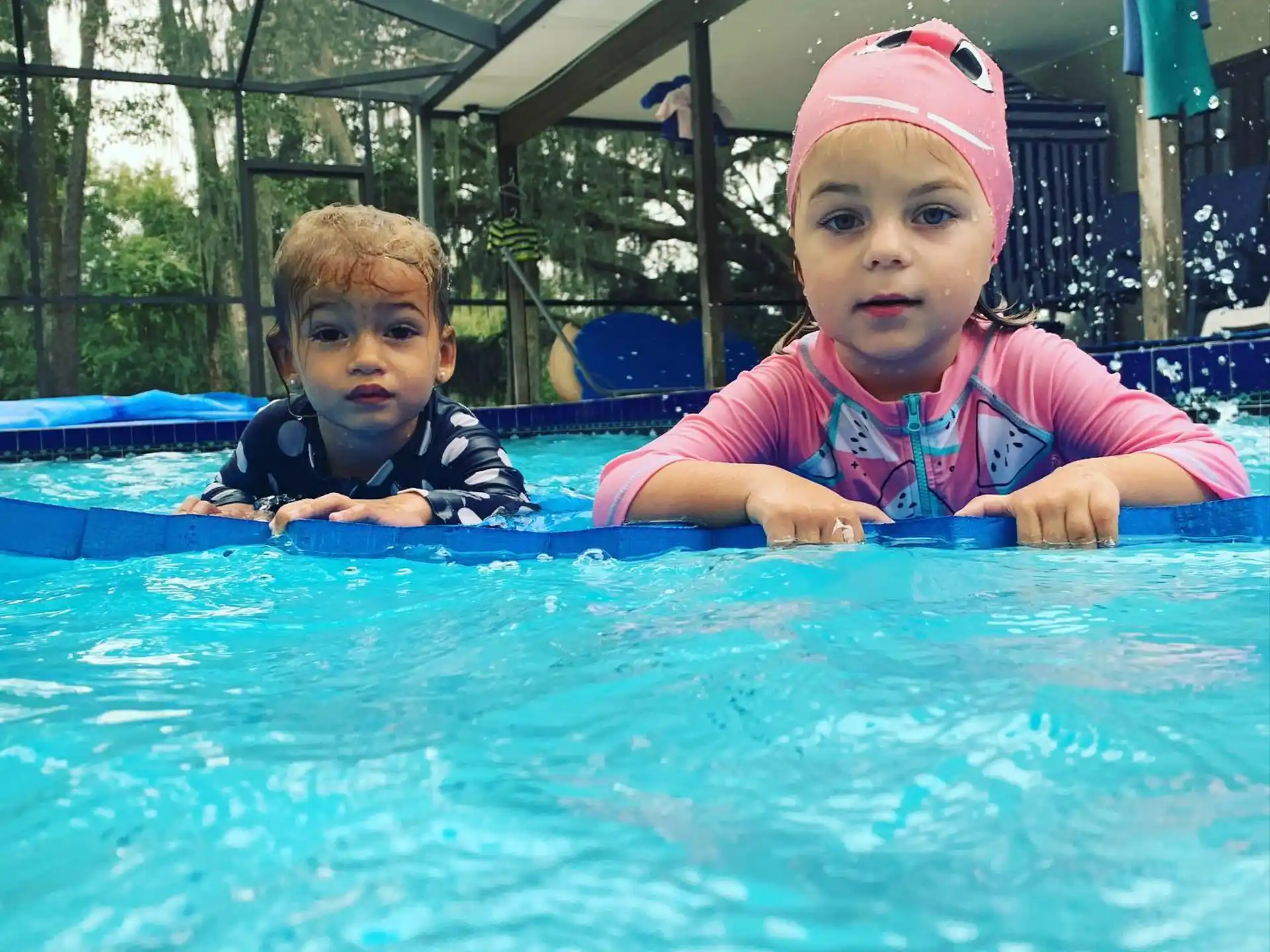 a group of kids in a pool