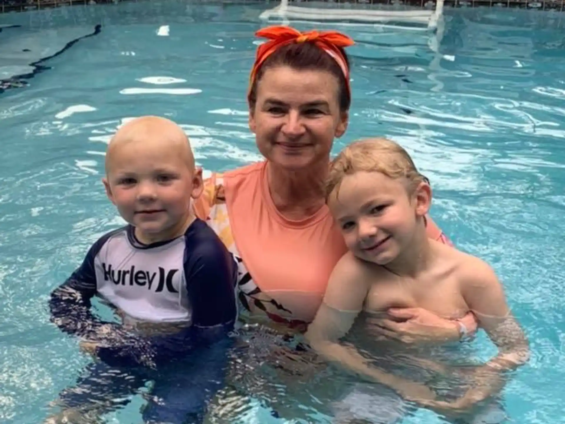 a group of people in a pool