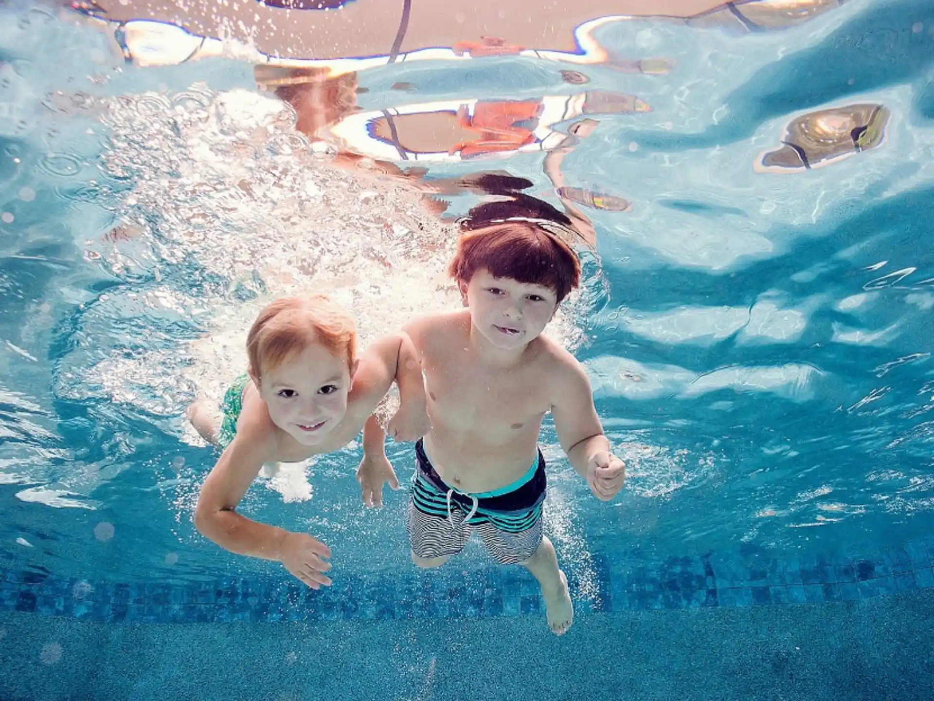 two boys in a pool