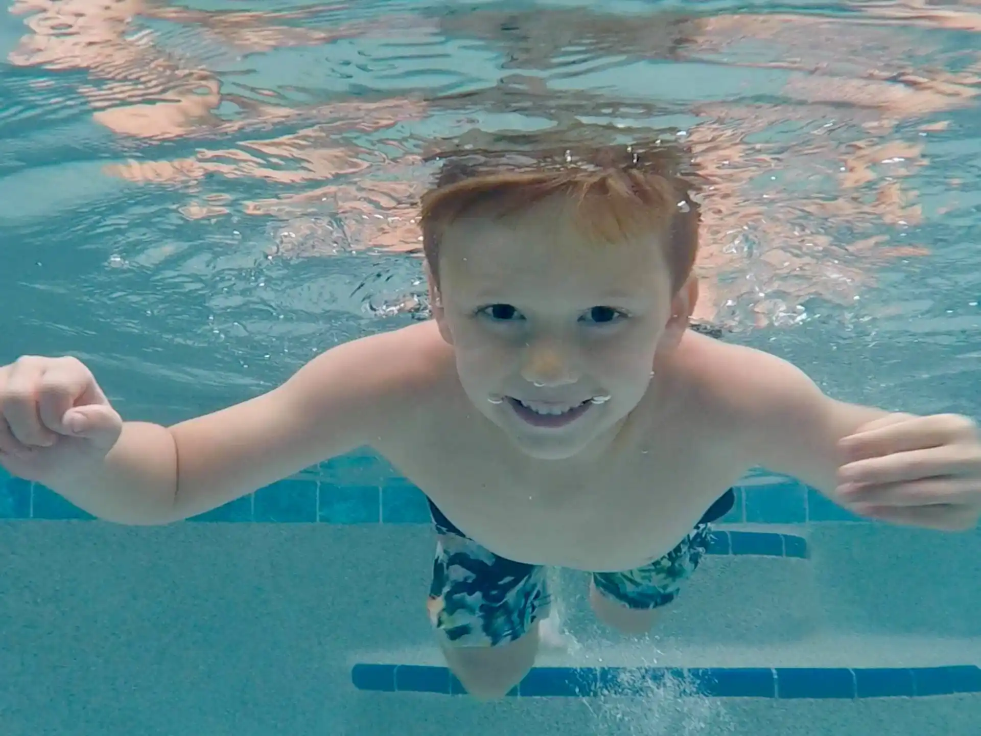 a boy in a pool